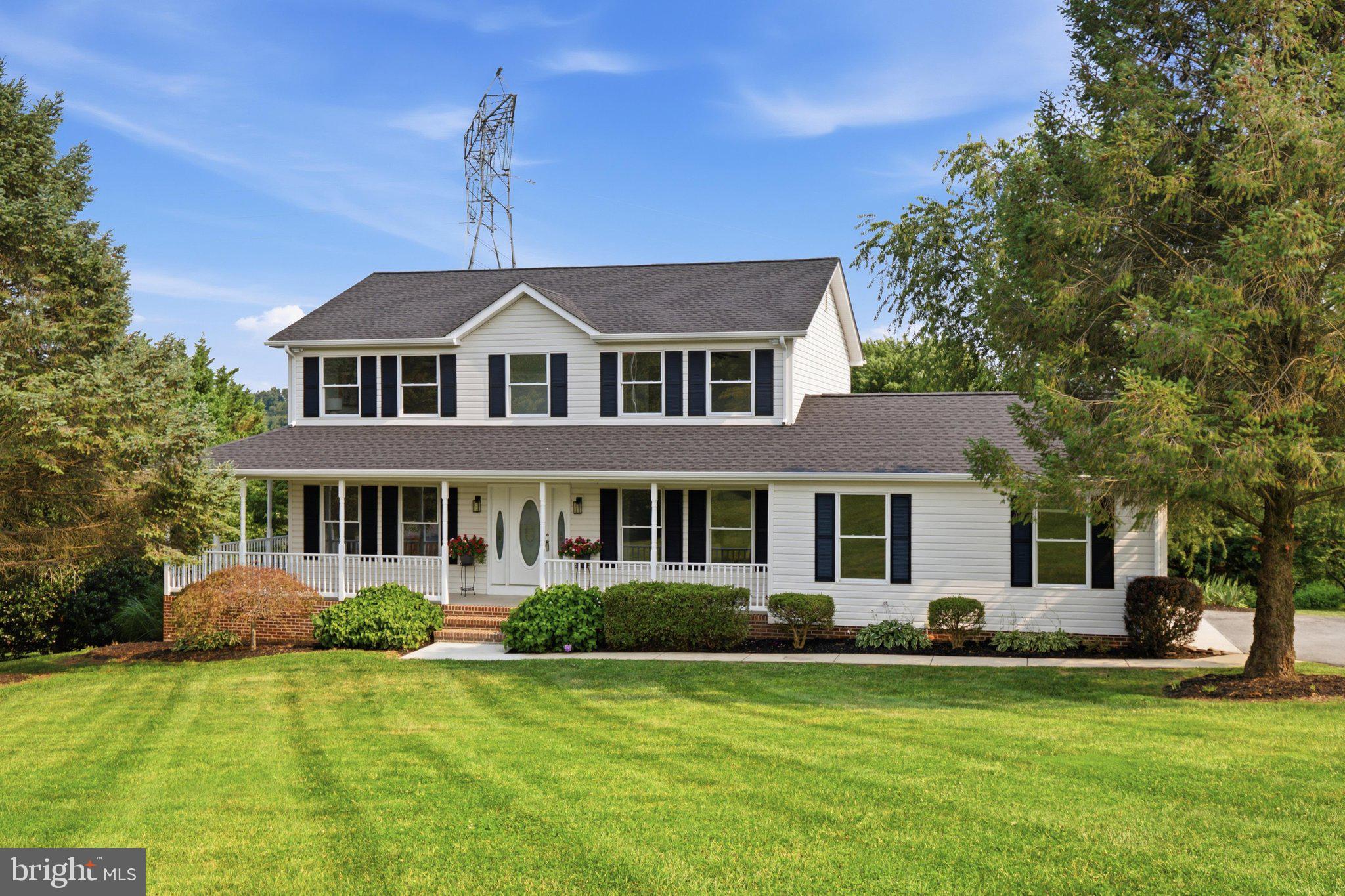 Tucked away on a quiet cul-de-sac in the highly sought-after Bradford Estates community, this beautifully updated home offers 4 bedrooms, 3.5 baths, and sits on a 1.07-acre lot. Pride of ownership is evident from the moment you arrive, with lush landscaping and a welcoming wraparound front porch setting the tone. Step inside to discover handsome new luxury vinyl plank flooring that flows throughout the entire main level.  The foyer is flanked by a private home office and a formal dining room, which seamlessly connects to the stunning, newly renovated kitchen. Featuring gorgeous quartz countertops, new cabinetry, stainless appliances, and a spacious center island with seating for four, this kitchen is designed for both everyday living and effortless entertaining. The kitchen opens to the breakfast area and family room, creating an inviting, open-concept gathering space. A sliding glass door from the breakfast area leads to the expansive rear deck, while a glass door from the family room provides access to the wraparound front porch. A spacious laundry room and convenient powder room complete the main level.
Upstairs, you'll find brand new carpet and four generously sized bedrooms, including a spacious primary suite featuring a large walk-in closet and a beautifully renovated en-suite bath with a dual-sink vanity, elegant tiled walk-in shower, and private water closet. Three additional bedrooms offer ample closet space and share a well-appointed hall bath. The finished lower level provides even more living space with a bright recreation room overlooking the backyard, two versatile bonus rooms—one with direct access to the rear patio—and a full bath, making it ideal for guests, hobbies, a home gym, or additional office space. Outdoor living is just as impressive, offering endless opportunities to relax or entertain on the charming wraparound front porch, expansive rear deck, or lower-level covered patio complete with a classic hanging wooden porch swing overlooking the peaceful countryside.  Bradford Estates is a wonderful neighborhood for walking, jogging, and connecting with neighbors, all while being conveniently located just minutes from shopping, dining, historic downtown Mount Airy, and I-70.