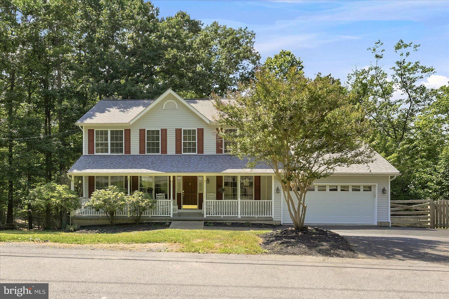 Nestled in the peaceful Shannondale community, this beautiful 4-bedroom, 2.5-bath home offers the perfect balance of privacy, nature, and convenience. Surrounded by mature trees and just a short stroll from the nearby stream at the bottom of your property, you'll enjoy the tranquility of country living while remaining just minutes from Route 9 and Route 340, making commuting a breeze.

Step inside to a welcoming floor plan featuring a warm and inviting living room centered around a cozy wood-burning fireplace. The spacious kitchen is designed with both style and functionality in mind, offering granite countertops and not one, but two pantries to provide exceptional storage.

The oversized two-car garage is ideal for hobbyists or anyone needing additional workspace, complete with  a built-in workbench. Downstairs, the full unfinished walk-out basement presents endless possibilities with tall ceilings, an egress window, and a rough-in for a future bathroom—creating the perfect opportunity to expand your living space, add a recreation room, guest suite, or home office.

Outside there is a fenced in area for your pets. These owners just had fresh blacktop done on the driveway, and just had the deck repainted too! You are not far from the famous Mountain Lake Club and the beautiful Shannondale Lake - take a walk there to spend your summer days! 

Whether you're relaxing on your property surrounded by nature, exploring the nearby stream, or enjoying the convenience of an easy commute, 152 White Oak Court offers the lifestyle you've been searching for. Don't miss your opportunity to own this peaceful retreat in the heart of Harpers Ferry.