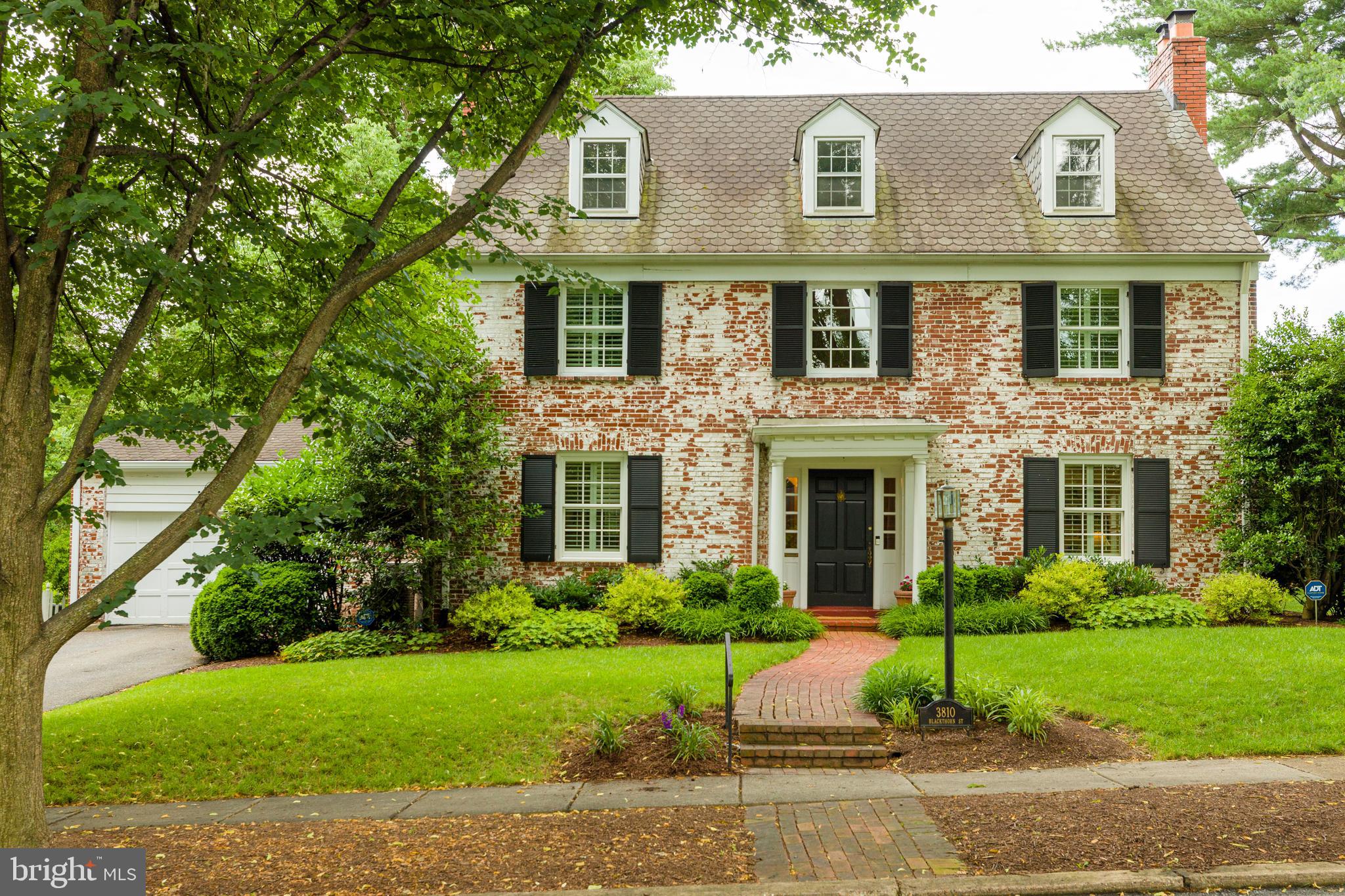 The stately brick colonial on a tree-lined street has been recently updated to include a stunning kitchen and exquisite owner's bath. Hardwood floors flow throughout this home with large windows and an elegant color palette that gives this home a light and sophisticated feel.  The living room has a gas fireplace and built-in cabinets, which are also found in the library/office. The dramatic dining room has a huge bay window with views of the landscaped side yard. The clean-lined kitchen has marble countertops, a Viking 6-burner stove, island and a farmhouse sink. The charming breakfast area leads to the convenient mud room. Upstairs, the owner's suite is expansive with two spacious walk-in closets.  The owner's bath has heated floors, marble shower and countertops and a vaulted ceiling. Two additional bedrooms and a large bath complete the 2nd level.  The top level is a sprawling space, perfect for a large bedroom with dormer windows and window seats and a large closet.  The LL has a recreation room with fireplace, storage area and a full bath. A brick patio and low maintenance landscaping make a perfect outdoor spot for entertaining. Walk to parks and dining or take a quick drive to downtown Bethesda!