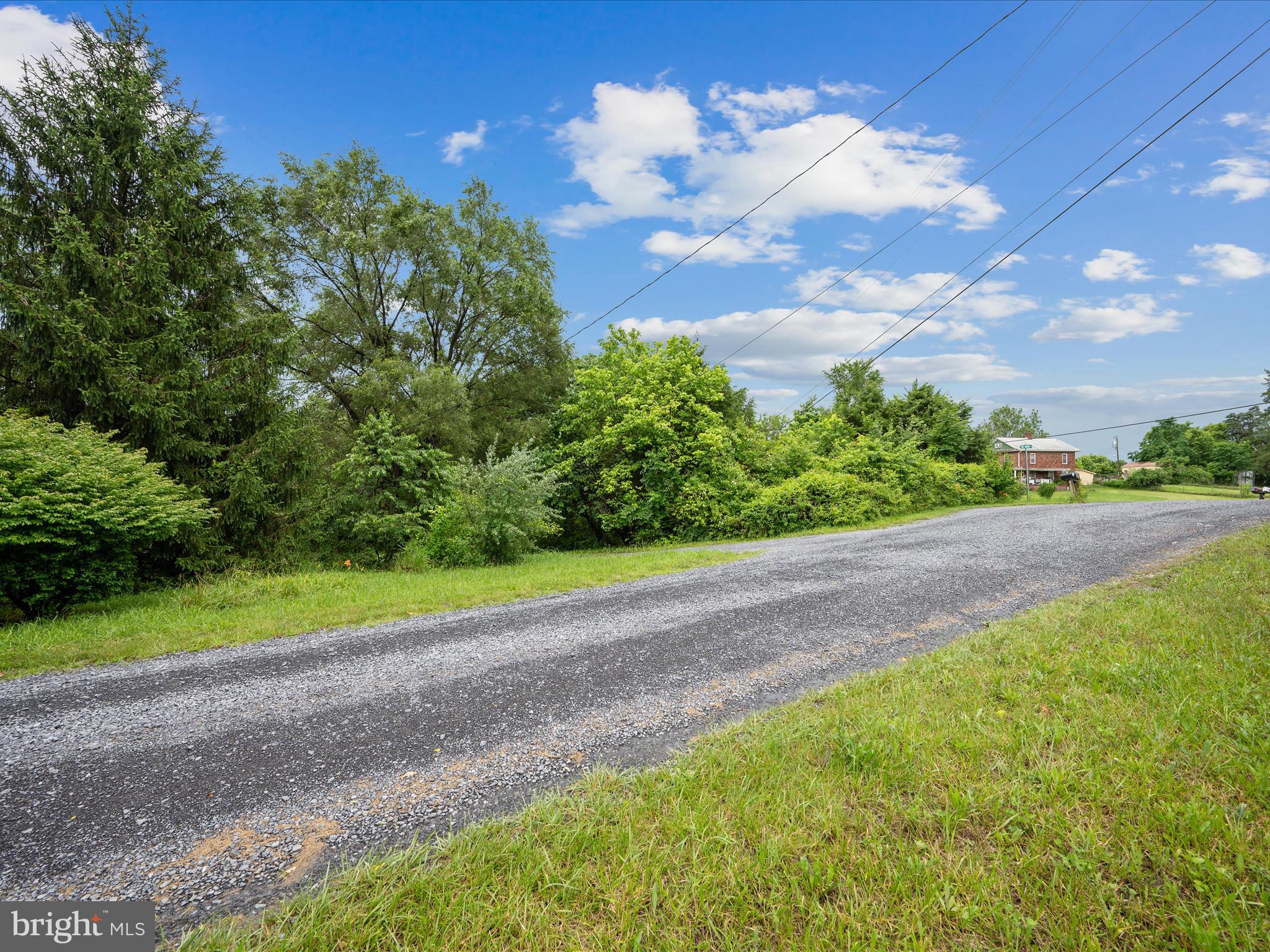 Seller has received multiple offers.  Final and Best deadline is  Friday, July 11th at 9:00 a.m.  Ready to make your country-living dreams a reality? This rare 1.23-acre gem in Historic Middleway is packed with potential and ready for you to bring your vision to life!  Situated on a private, heavily wooded corner lot, this unrestricted property gives you the freedom to live how you want—yes, it’s chicken and goat friendly! Whether you're dreaming of a peaceful weekend retreat, a future homesite, or a mini homestead, this is your chance to grab a slice of tranquility.  Enjoy the bonus of existing well and septic—a huge head start and cost-saver for your plans! While the lot includes an unregistered mobile home, it's being sold as-is and can be removed at the buyer’s expense, giving you a clean slate to build, camp, or invest.  You’ll love the secluded feel without sacrificing convenience. Just minutes from I-81, I-70, I-270, and I-68, you're in a prime location with easy access to Maryland, Virginia, restaurants, schools, and shopping. Country quiet meets commuter convenience—it’s the best of both worlds.  No drive-bys, please—schedule your private tour today and come explore this hidden treasure for yourself! Don’t miss out on a rare opportunity to own a versatile piece of land in one of West Virginia’s most charming and historic areas.