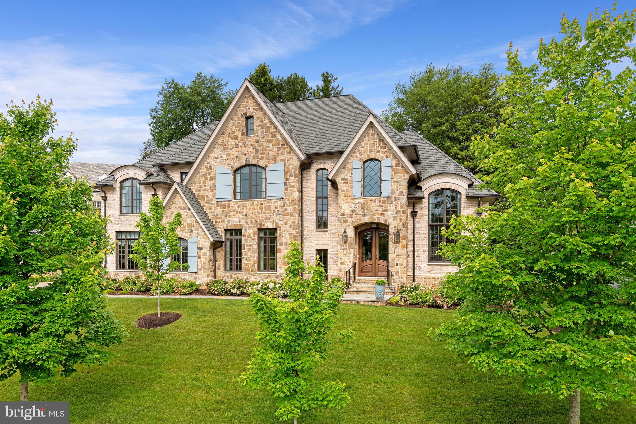 Absolutely Stunning French Country Residence in Country Club Hills.    Custom built by renowned builder, Sunline, this gorgeous sun-filled home is the quintessential offering of modern elegance.  The grand two-story foyer welcomes you to the gracious living spaces of 3200 N Abingdon Street.  The main level enjoys a gourmet chef’s kitchen with Thermador appliances, marble countertops and luxuriant island space, which opens to the living room centering around the magnificent stone surround fireplace.  Off the kitchen, the mudroom with powder room, secondary pantry and custom shelving can be found.  Additionally, a cozy den with hidden television, living room with cathedral window, 2nd powder room, gorgeous dining room with adjacent butler’s pantry, are all featured on this level.  The upper level boasts a beautiful and spacious owner’s suite with double walk-in closets, en-suite bathroom with glass-enclosed shower, free-standing tub, remote controlled window treatments and double vanity. Three additional bedrooms, all with en-suite baths, as well as laundry area, are also found on this level.    The lower level features an incredible entertaining space with gas fireplace, bar, game area, and seating for even the largest of gatherings.  A fifth bedroom with en-suite bathroom along with separate exercise room and additional storage space are all on this fabulous level.    Outside, the private and verdant rear yard hosts a lovely slate patio and pergola.  A gorgeous stone fireplace with gas lantern centers the plentiful seating space and built-in grill.    The home’s fine craftsmanship is accentuated by designer and bespoke detailing throughout.  Combined, these elements create an exquisite offering in one of Arlington’s most coveted neighborhoods.