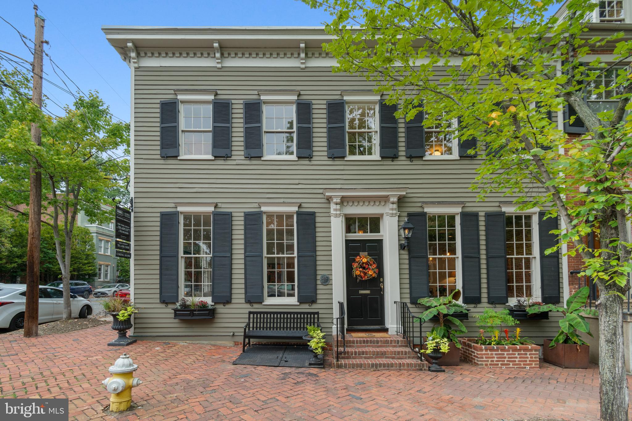 This Old Town Alexandria colonial is a modern twist on a historic home. Open flow for comfortable family living & entertaining in spacious rooms with 11 ft. ceilings on main level. Library has built-ins that adjoins the sleek renovated chef's kitchen with Subzero refrigerator, Viking microwave and stove/oven & Bosch dishwasher. Exposed brick in kitchen & dining room, lending an architectural touch. Recently renovated bath with large shower & seamless glass shower door. An abundance of natural light flows throughout. Lovely private court yard & patio for outdoor living enjoyment. The fireplace in the kitchen is a telltale sign of its historic past. Basement accessed from street level with stairs, concrete flooring and recessed lighting. Ideally located near King Street and the waterfront to partake in local events and fine dining.