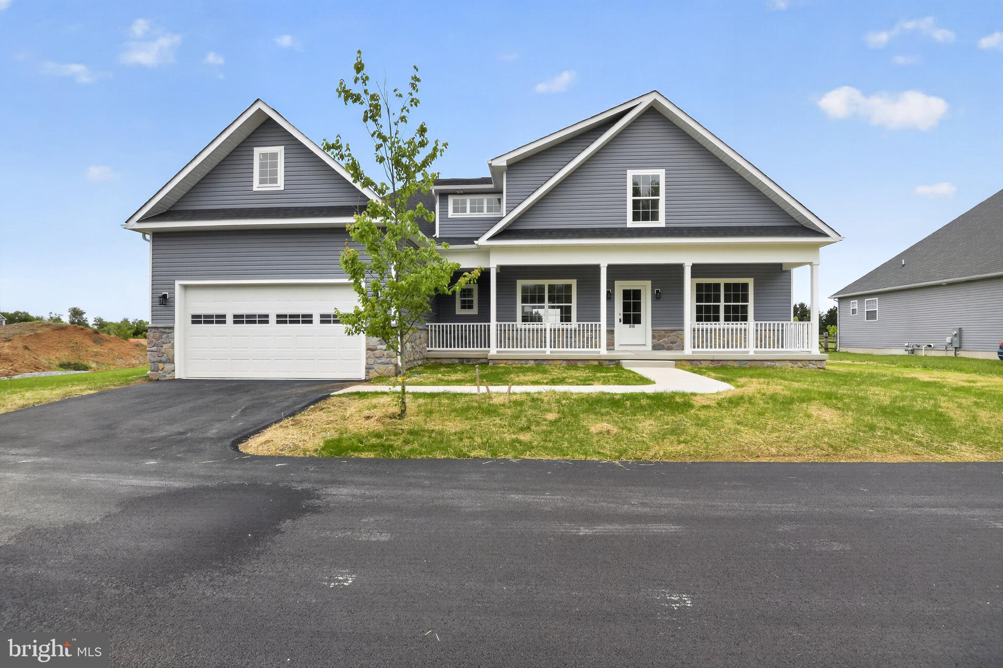 Brand New Quick Delivery Home -  The Bethel Model with a partially finished lower level and Optional Second Floor Suite  -   Welcome to Summit Circle, an exclusive enclave of just fourteen homesites surrounded by beautifully landscaped open space. Situated on a spacious half-acre lot, this stunning new construction Bethel Model.

This thoughtfully designed home features 4 bedrooms, 3 full baths, a versatile flex room, and a 2-car garage. The open-concept layout creates an inviting atmosphere perfect for both everyday living and entertaining. At the heart of the home, the expansive family room flows seamlessly into the dining area and  kitchen, complete with maple cabinetry, stainless steel appliances, and a natural gas range.

The private owner’s suite is tucked away from the secondary bedrooms for added comfort and tranquility, featuring a luxurious ensuite bath with a soaking tub, separate shower, enclosed water closet, and walk-in closet. Off the foyer, the flex room provides the ideal space for a home office, formal dining room, or den.

The second-floor suite adds exceptional flexibility with an additional bedroom, full bath, and study nook — perfect for guests, multigenerational living, a private office, or creative studio space.

The Partially Finished full basement offers abundant storage and endless possibilities for future finishing, whether for recreation space, a home gym, office, or guest suite. Outside, enjoy the charm of the full front porch and attractive curb appeal.

Built with energy efficiency in mind, this home includes a high-efficiency natural gas furnace, Low-E windows, and the peace of mind of a 10-year new home warranty.

Additional homesites and floorplans are available in this sought-after Summit Circle community.