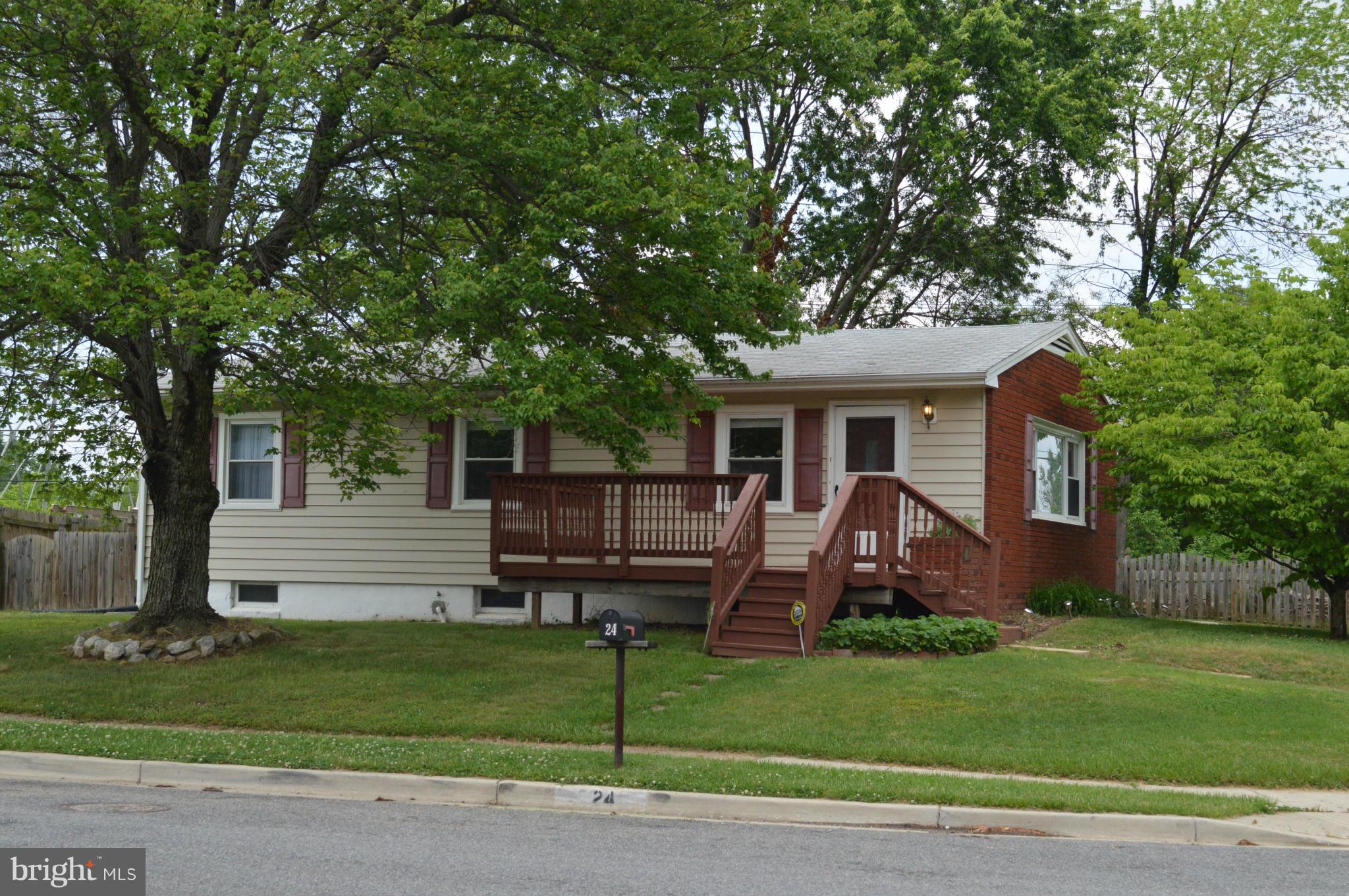 Lovely rancher on large corner lot with enormous fenced yard, glass enclose rear porch, two storage sheds, driveway and front deck.  Large open kitchen with island, dining room, living room, track lighting and laminate wood flooring.  Full basement with full bath framed; shower roughed in and the rest ready to go.  Basement has been waterproofed with French Drain system ready for you to finish.