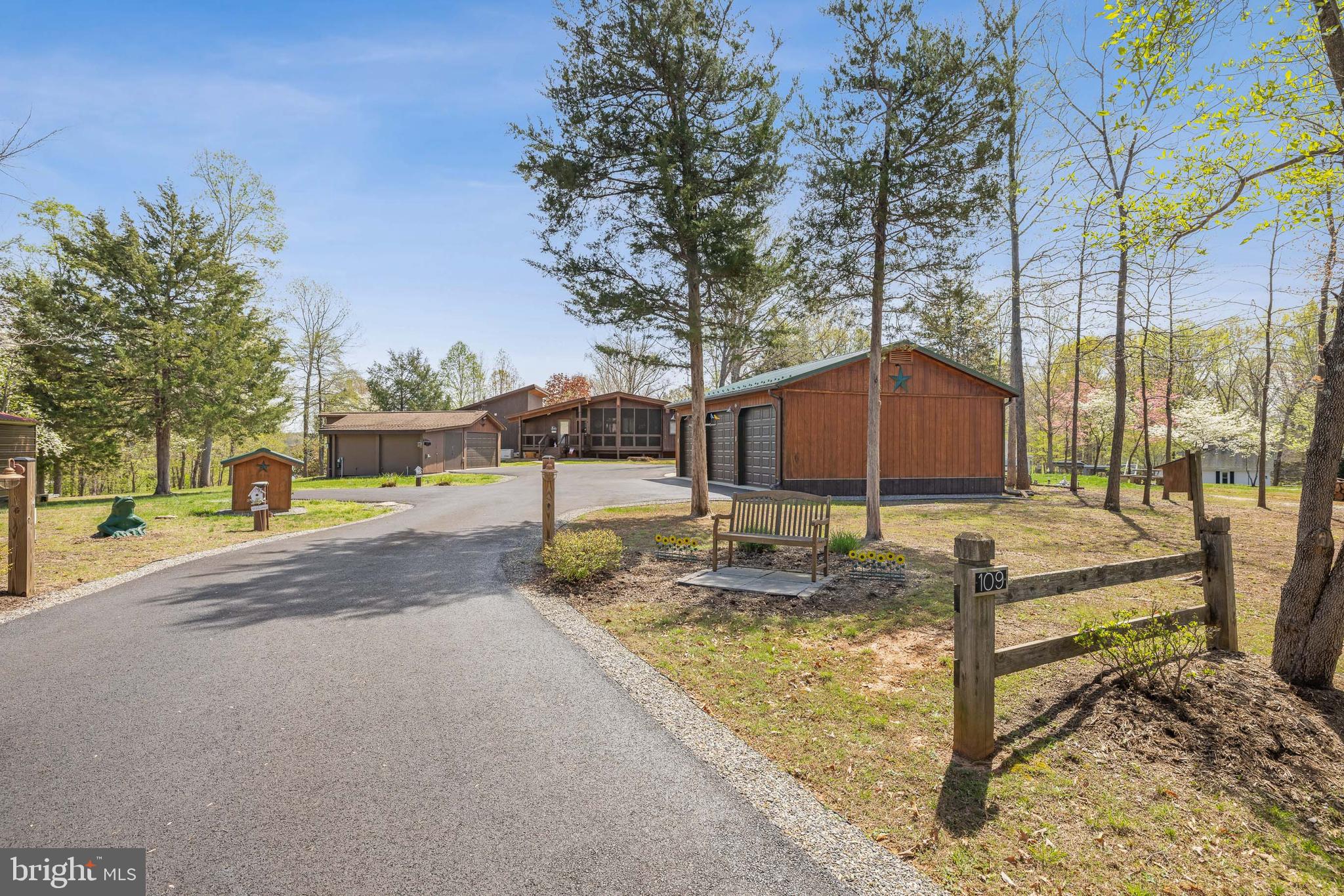Experience the charm and character of this one-of-a-kind Lake Anna retreat, offered for sale for the very first time by its original owner. Lovingly maintained and thoughtfully designed, this exceptional property is far from cookie-cutter and delivers the perfect blend of privacy, flexibility, and lake lifestyle living.

Nestled on a beautifully wooded corner lot in a gated Lake Anna community on the public side, this distinctive contemporary home offers a peaceful, park-like setting just minutes from all the lake’s most sought-after amenities without the waterfront price tag.

From the moment you arrive, you’ll notice the difference. Mature trees, meticulously maintained landscaping, a paved driveway, and warm contemporary architecture create an inviting sense of arrival. Expansive windows fill the home with natural light while capturing serene wooded views and seasonal glimpses of Lake Anna. The open-concept layout and seamless indoor-outdoor flow make everyday living and entertaining effortless.

Step outside onto the spacious rear deck the perfect place to relax, entertain guests, or enjoy quiet mornings surrounded by nature.

This rare multi-structure property offers incredible versatility with multiple outbuildings ideal for storage, hobbies, workshop space, or future possibilities. A detached garage, generous paved parking area, and spacious lot provide room for boats, guests, outdoor recreation, gardening, or expansion.

Additional features include:

Conditioned concrete crawl spaces
Whole-house Generac generator
Large paved driveway
Detached garage
Mature landscaping and wooded privacy
Seasonal lake views
Gated community access on the public side of Lake Anna

Whether you’re searching for a full-time residence, weekend escape, or investment opportunity near Lake Anna, this unique property offers comfort, character, and lifestyle in one exceptional package.

Virtual tour available, though this special home is truly best appreciated in person. Showings by appointment only.

Welcome home to Lake Anna.