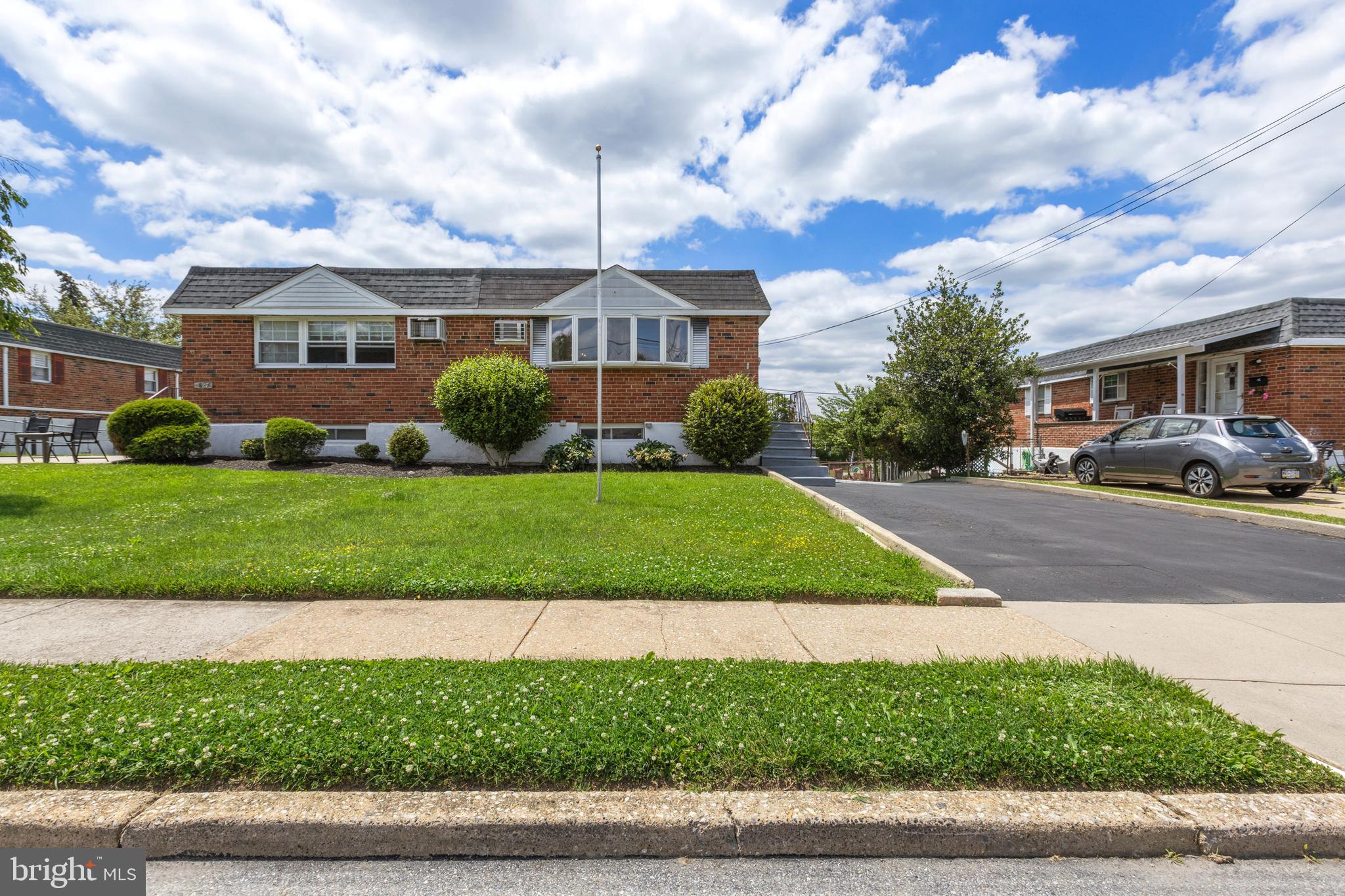 Welcome to 629 Clay Drive, a well-maintained brick twin located in the desirable Plymouth Park neighborhood of Conshohocken. Lovingly owned and cared for by the same owners since it was built in the 1960s, this 3-bedroom, 2-full-bath home offers the perfect combination of convenience, character, and opportunity. Showcasing beautiful red brick construction across the front, sides, and rear of the home, this classic residence reflects the quality and craftsmanship of its era. Nestled in one of Montgomery County's most vibrant and growing communities, enjoy easy access to upscale dining, boutique shopping, the Norristown/Center City rail line, major highways, and the scenic Schuylkill River Trail connecting Valley Forge to Center City Philadelphia.
A private driveway-side entrance welcomes you into a bright and spacious living room highlighted by a large front-facing bay window. Original hardwood floors extend throughout the main level, flowing into the dining area, hallway, and all three bedrooms. The kitchen features a full complement of appliances, wraparound cabinetry, and plenty of potential for future customization.
Three bedrooms are conveniently located on the main level and share a full hall bath. The finished walk-out lower level significantly expands the living space, featuring an additional 900+ finished square feet, a large family room, full bath, laundry area, and an impressive custom-built 10-foot bar perfect for entertaining. With abundant flexible space, the lower level could easily accommodate a recreation room, home office, studio, guest quarters, or additional sleeping area. A pool table area currently occupies the front portion of the basement, offering even more room for gatherings and recreation.
Step outside through the lower-level door to a charming screened porch with louvered glass windows on three sides, creating the perfect spot to relax and enjoy the outdoors. The rear yard features green lawn space, partial fencing, a classic brick charcoal grill, and a large cinder block storage shed with a locking door.
The home is comfortably heated on both the main and lower levels by radiant baseboard heat powered by a newer natural gas boiler installed in 2024. Cooling is provided by a through-wall air conditioning unit serving the main living area along with separate window units in the bedrooms. Additional peace of mind comes from a newer water heater installed in 2022.
Located within the highly regarded Colonial School District and just moments from Colwell Lane, Sutcliffe Park, community festivals, annual fireworks, playgrounds, and recreational amenities, this home offers an outstanding opportunity to enjoy the Conshohocken lifestyle. With easy access to Center City Philadelphia, King of Prussia, Plymouth Meeting, Valley Forge, and major employment centers throughout the region, 629 Clay Drive is ready to welcome its next owner home.