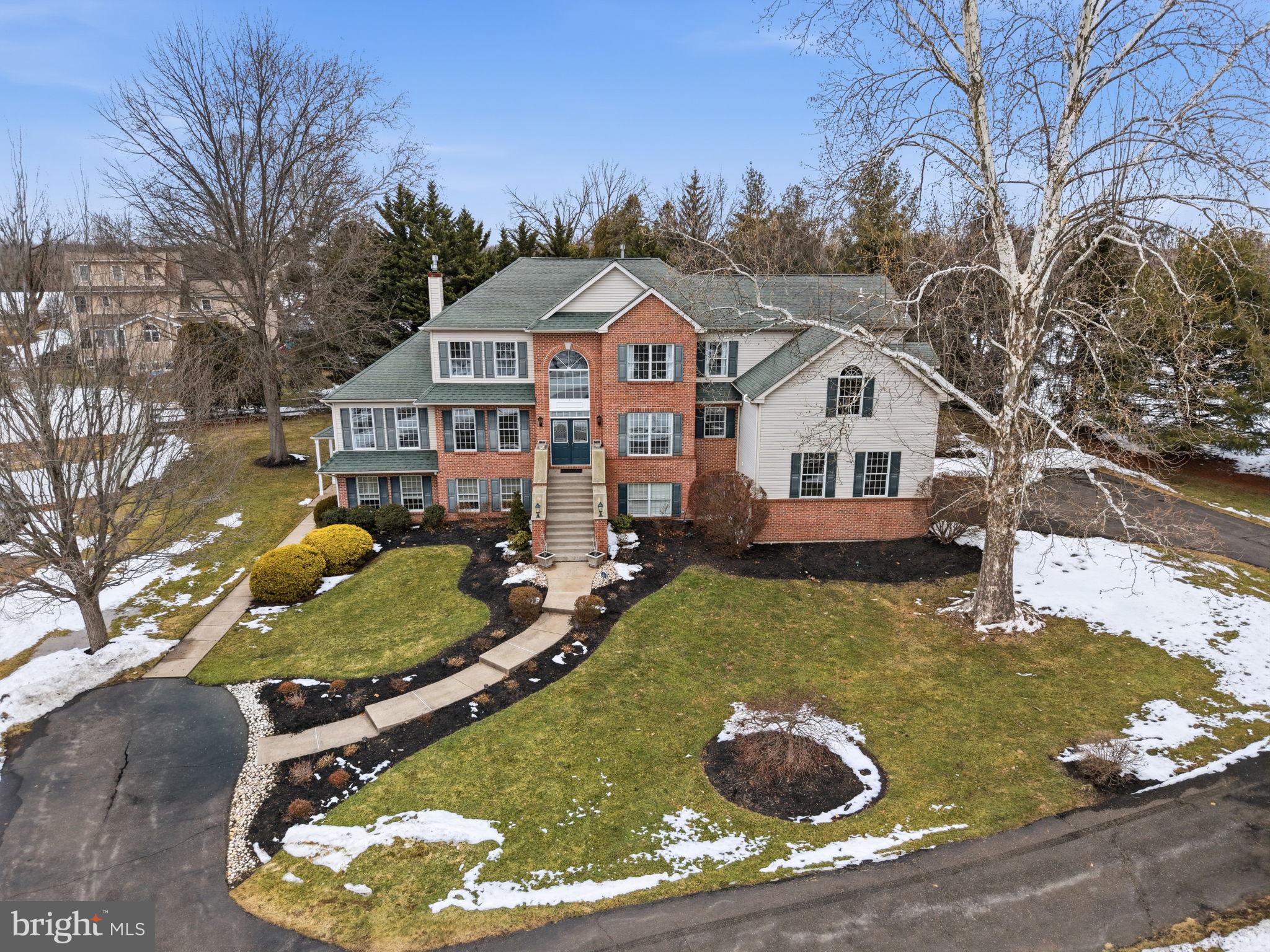 Tucked away in an exclusive cul-de-sac, this exceptional custom built home is the epitome of luxury and versatility offering an incredible IN LAW/AU-PAIRE living quarters that is entry level with its own separate access. This 7-bedroom, 4.5-bathroom home spans over 6,000 square feet, offering an impeccable blend of elegance, comfort, and practicality—ideal for families, multigenerational living, or hosting in style. From the moment you step into the dramatic two-story foyer, with its gleaming hardwood floors and sweeping curved staircase, you’ll know this home is something special. Every corner reflects thoughtful design, custom millwork, and timeless sophistication. A private office and formal living room flank the entry, the latter connecting to a sunlit bonus room via French doors—a perfect setting for a piano or cozy reading nook. The formal dining room, accented with French doors and wainscoting, flows seamlessly into the gourmet kitchen. Here, culinary dreams come to life with granite countertops, a central island, built-in appliances, a walk-in pantry, and a slider leading to a sweeping, maintenance-free deck that overlooks your private pool and tranquil backyard oasis. The adjacent great room is nothing short of grand, featuring soaring cathedral ceilings, a back staircase, skylights, custom built-ins, and even a built-in bar with a wine fridge—perfect for entertaining. The primary level also boasts a powder room and a mudroom/laundry room with access to the oversized 3-car garage complete with epoxy floors and a separate entrance to the side driveway.   Upstairs, the primary suite is a sanctuary of its own, with double doors opening to a spacious retreat featuring new carpet, crown molding, dual walk-in closets, and an attached bonus room with cathedral ceilings—perfect for a gym, office, or a tranquil escape. The spa-like, newly renovated primary bath includes a soaking tub, tiled stall shower, double vanity, and a water closet. Four additional generously sized bedrooms and another updated full bath complete this level. Included in the house at entry level is a rare gem: a fully equipped, entry-level apartment with its own private entrance, a full eat in kitchen, living room, dining room, along with two bedrooms as well as its own separate parking area, offering unparalleled flexibility for guests or extended family. The outdoor space is equally impressive, designed for both relaxation and recreation. An expansive deck, a charming gazebo, and a sparkling pool make this backyard a private paradise, while the spacious driveway ensures ample parking for all your guests. Recent updates like new HVAC, fresh paint, newer appliances, and a new pool cover add peace of mind and modern convenience. Located within walking distance to Maple Glen Elementary and close to everything Upper Dublin has to offer, this home is a rare find that combines luxury, functionality, and a prime location. Don’t miss the chance to make this extraordinary property your forever home!