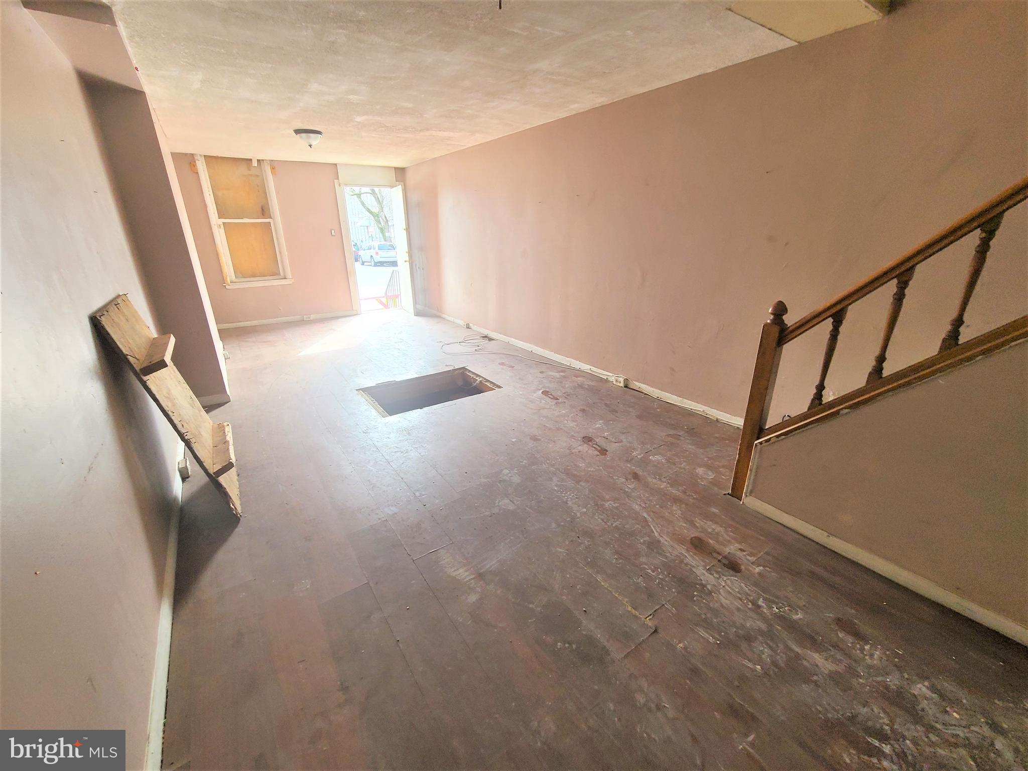 CALLING ALL INVESTORS!  Spacious rowhome with large room sizes - perfect opportunity to fix up and add to your rental portfolio.  Main level with an open floor plan, spacious living room with a dining area, and a kitchen, upper level with 2 bedrooms and 1 full bath.  Sold As-Is!  Seller will make no repairs.
