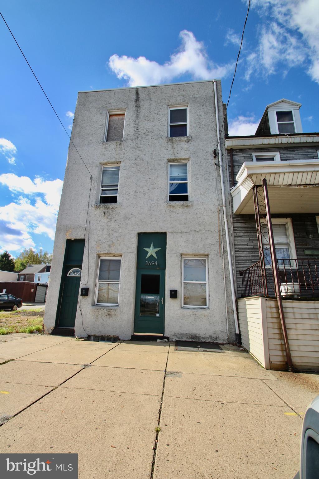 Rarely offered three story duplex in Bridesburg!  This building offers two (2) bedroom apartments.  Unit 1 has an open floor plan, laundry closet, good size kitchen + 2 beds.   Unit two is a bi-level, open living, two bedroom unit w/ laundry.  Separate gas + electric meters.  Full basement w/ mechanicals + storage.  Huge rear yard for tenants to enjoy.    Property has some damage from a fire from a building that was located next door.  Being sold in 100% "as-is" condition.  Seller will make no repairs.  Buyer responsible for U+O.  Utilities are off and will not be reactivated for any inspections.   With some work, this cash cow could potentially pull in around $2,500 month.