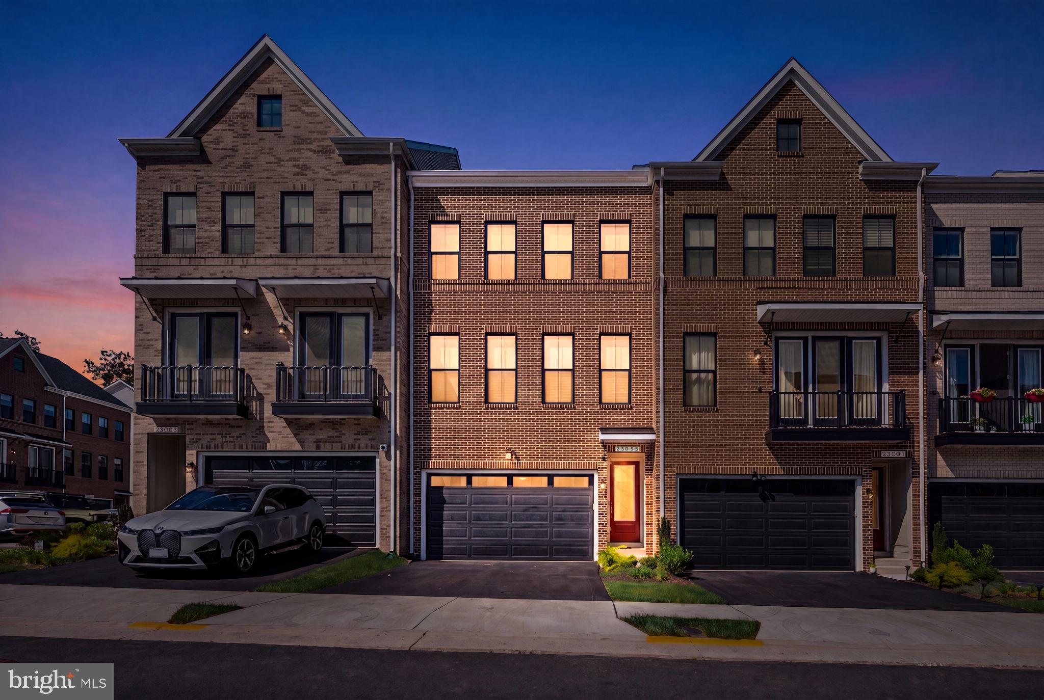 Experience modern luxury in this beautifully designed four-level townhome in West Park III at Brambleton. Built by Van Metre Homes in 2024, the sought-after RAYLEIGH floorplan offers 2,576 square feet of thoughtfully designed living space with 4 bedrooms, 3 full bathrooms, 1 half bath, and a 2-car front-load garage. <br> <br>

The open-concept main level is built for both everyday living and entertaining, featuring a chef-inspired kitchen with quartz countertops, upgraded cabinetry, stainless steel appliances, and an oversized center island. The spacious great room flows seamlessly to a private deck, creating the perfect indoor-outdoor living experience. <br> <br>

Upstairs, the expansive primary suite includes a generous walk-in closet and a spa-inspired bathroom with dual vanities and an oversized frameless shower with built-in seating. Two additional bedrooms, a full bath, and a conveniently located laundry room complete the upper level. <br> <br>

The entry level adds valuable flexibility with a spacious recreation room, a fourth bedroom, and a full bathroom—ideal for guests, a home office, or multi-generational living. Built to modern energy-efficiency standards, this home also includes the remainder of the builder's post-settlement warranty. <br> <br>

Located in West Park III, within the award-winning Brambleton community, residents enjoy access to scenic trails, parks, pools, playgrounds, community amenities, and the vibrant Brambleton Town Center with its shopping, dining, and entertainment options. <br> <br>

Don't miss the opportunity to own a nearly new home that combines modern design, premium finishes, and an exceptional location. Schedule your private showing today!
