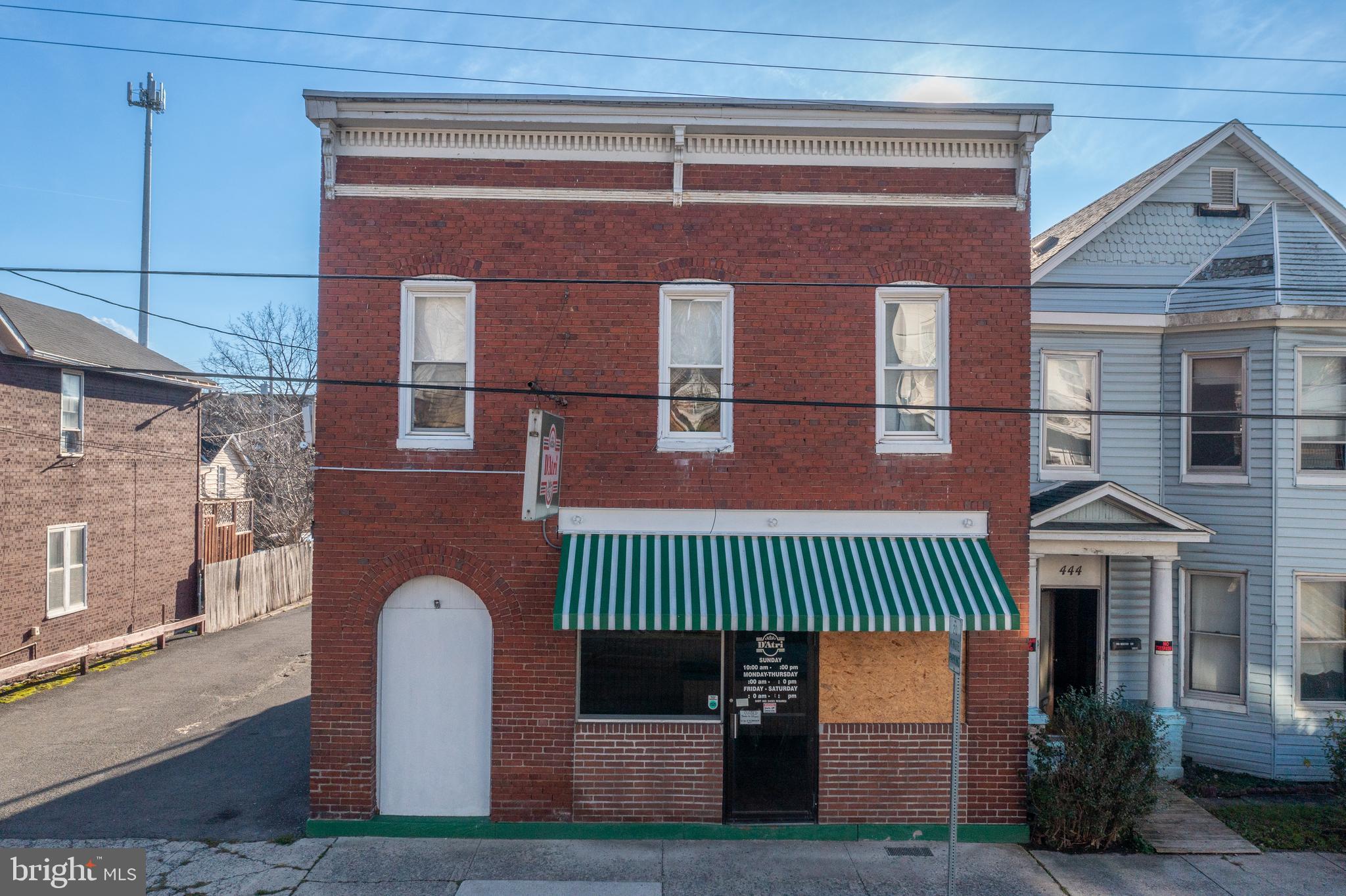 Welcome to 440 Columbia Street- the original home of the iconic D'Atri's Subs. Built in the late 1800's, this building has a rich history. Beginning as a neighborhood meat market, it later became D'Atri's, which became one of the most long-standing, successful family-owned businesses in Cumberland. This property features a restaurant space on the first floor that offers a take-out counter, a pizza oven, commercial sink, a six foot grill and walk-in fridge. Upstairs, there is a 1 bedroom, 1 bathroom apartment that offers flexibility. Own a restaurant and live upstairs? Or rent the apartment for extra income? The choice is yours! Outside, there is a large parking lot that comes with the building. Call today! This property offers commercial space for an affordable price tag. Can be purchased in a package with 444 Columbia Street.