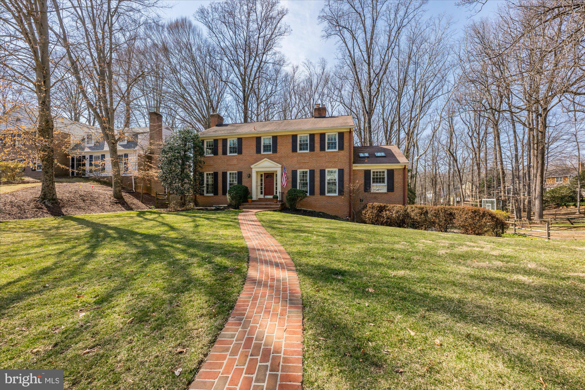 This is one of those rare homes that instantly feels just right--a place where warmth, charm and comfort come together effortlessly.  Thoughtfully designed spaces invite you to relax, unwind and truly feel at home.  Cozy up by the crackling wood-burning fireplace,  admire the rich character of beam ceilings, relax while sitting on the covered porch listening to birdsongs in the backyard...enjoy the perfect blend of timeless elegance and everyday comfort.  You will be enchanted from the beginning with this handsome all brick, approximately 4,500 SF Gosnell colonial. Upon entering, your eye will be drawn to the gracious front-to-back Foyer with a sweeping staircase.  The baby grand piano size Living Room is stunning with triple exposure and French doors leading to the back deck.  On the opposite side of the center hall is the formal Dining Room for holiday gatherings.  The heart of this home is the beautifully expanded Kitchen and Family room - a perfect blend of function & style.  The vaulted-ceiling addition creates an inviting space for a large sectional sofa, ideal for hosting friends and catching every thrilling moment of March Madness.  The Chef's Kitchen with its causal country charm, features updated stainless steel appliances, a classic farm sink, top-of-the-line cabinetry, upgraded granite counters and skylights that bathe the space in natural light. A breakfast bar seamlessly connects to the spacious eating area, making everyday meals and entertaining effortless.  Just beyond, a covered porch provides the perfect escape-whether you're sipping a morning coffee or curling up with a good book on a rainy afternoon.  The upper level is anchored by a sumptuous Primary Suite, complete with a reconfigured/renovated full bath, as well as expanded closets for easy organization.  Three additional big bedrooms and an updated hall bath complete the second floor. Downstairs, the lower level offers endless possibilities - a fantastic Recreation Room  with space suited for toddlers, teenagers or the ultimate man-cave.  The separate Laundry Room features additional cabinetry and a must-have laundry tub. Tucked around the corner, the 5th bedroom/Au Pair suite/home office is a true retreat, boasting a spectacular picture window and sliding glass doors .  Don't miss the thoughtfully designed mudroom w/custom cubby built-ins.  The backyard is a dream offering peace and privacy, backing to dedicated green space.  Inside the fully fenced backyard is a mulched play area or future herb garden for those with a green thumb :-)  What sets this neighborhood apart is its vibrant sense of community, centered around the beloved swim/tennis club.  Here, friendships are forged through the excitement of swim, dive and tennis teams, creating unforgettable summer memories. If you love the outdoors, you will LOVE this location with quick access to Great Falls National Park, the C&O Canal and Billy Goat Trail. Bike into Georgetown, hike the trails or kayak on the canal or even the Potomac River for those more experienced kayakers.  Easy access to the Beltway, I-495; the BioMed Corridor, I-270 and downtown is available via the Clara Barton Parkway. Both major airports- Reagan National and Dulles International Airports are about half an hour away, non-rush hour. Local shopping can be found a few miles away in Potomac Village.  Come enjoy a community and lifestyle like none-other! This is more than a house--it's a feeling.  Make it yours today! Whitman schools too!