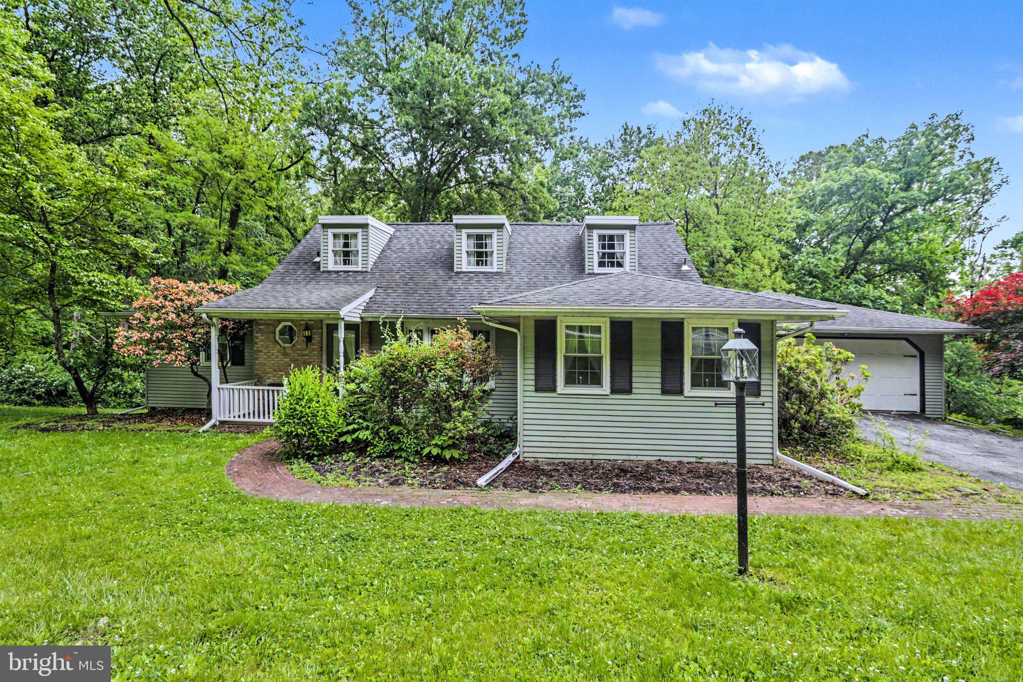 This 2 story Cape Cod on 1.82 wooded acres is waiting for it's new owners!  The main level offers a large family room with fireplace overlooking the private back yard.  There's a formal living room and dining room, a main level primary bedroom and full bath.  The kitchen is large with a breakfast area and sliding glass doors open to the large deck over looking the back yard so you can enjoy the peace and quiet.  Upstairs there are 2 bedrooms with hardwood floors and a full bath.  The 3rd bedroom has a large walk-in closet.  The basement is unfinished with sliding glass doors to a patio under the large deck.  The space could be finished for more living space if one desires.  The property is an estate and is being sold in as is condition.