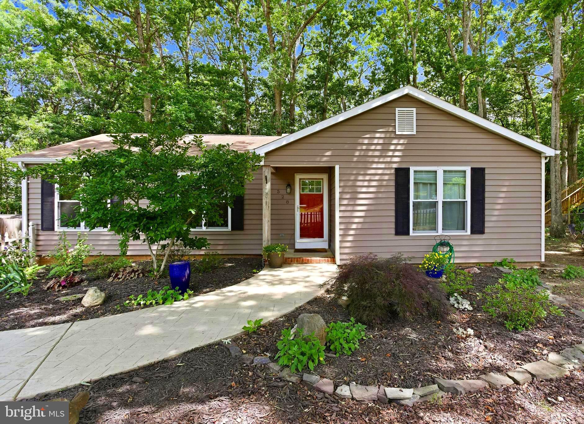 Welcome home to 528 Pleasants Drive! Move right into this impeccably maintained 3-bedroom, 2-bath home featuring gorgeous hardwood floors, fresh paint, and an inviting open floor plan - perfect for everyday living and entertaining. Enjoy preparing meals in the beautiful spacious kitchen outfitted with stainless steel appliances, or gathering around the charming brick fireplace, which opens up to a large living room and separate dining area. The updated bathrooms and stylish new lighting add modern touches throughout.  Outside, you’ll love the exceptional curb appeal highlighted by intricate landscaping and a private wooded lot that provides a peaceful setting. New bright landscaping in the back adds just the perfect touch to the low maintenance yard. Nestled in a quiet neighborhood with no HOA, this home offers both privacy and convenience, with easy access to shopping, dining, schools, and other local amenities. A truly move-in-ready opportunity you won’t want to miss! Schedule your showing today!