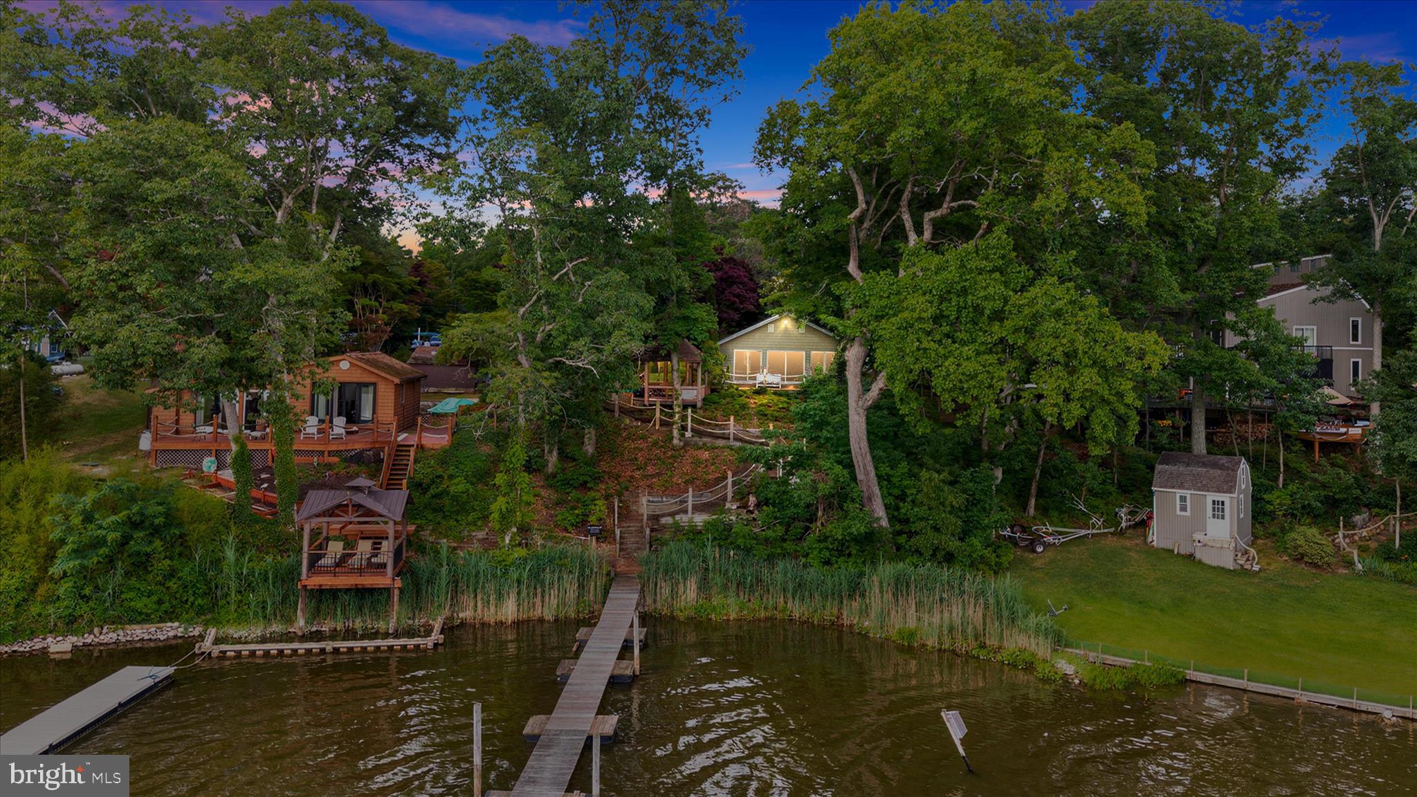 Welcome to Wymont Park, a sought-after waterfront community on picturesque Still Pond Creek, where every day feels like a vacation on Maryland's Eastern Shore. From sipping your morning coffee while watching the sunrise over the water to enjoying breathtaking waterfront sunsets from your private floating dock, this unique property offers the lifestyle you dream about.

Nestled on a beautiful waterfront lot, this versatile property features two separate living spaces, making it ideal for multi-generational living, guest accommodations, or potential rental opportunities.

The charming waterfront cottage offers 1 bedroom, 1 full bath, and 1 half bath, highlighted by a spacious living room with cathedral ceilings and panoramic views of Still Pond Creek. The kitchen provides abundant cabinet and counter space, making it perfect for entertaining. 

Adding even more value is the oversized detached garage with a fully equipped second-floor apartment, complete with 2 bedrooms, a full kitchen, living room, and full bath. Whether you're hosting extended family, accommodating guests, or creating a private workspace, this additional living area offers endless possibilities.

Step outside and discover what truly makes this property special. A large wraparound deck leads to a gazebo, creating the perfect place to relax and take in the peaceful creek views. Follow the path to your private floating dock, ideal for boating, kayaking, fishing, crabbing, paddleboarding, or simply enjoying life on the water.

Located in one of Kent County's most desirable waterfront communities, this property offers the perfect combination of privacy, natural beauty, and Eastern Shore charm. Whether you're searching for a full-time waterfront residence or weekend getaway, this rare waterfront property is ready for its next owner to make it their own.

Don't miss your chance to own a piece of Maryland's Eastern Shore waterfront lifestyle on Still Pond Creek.