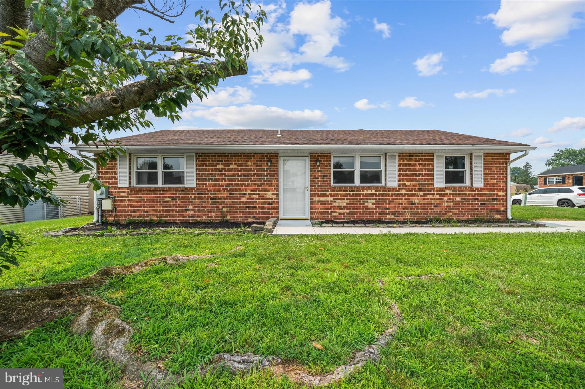 This home qualifies for 100% financing with no mortgage insurance!  This type of home is a rare find in this price range! Enjoy the convenience of a large corner lot with attached oversized garage (with opener) and two driveways. Renovations to the interior have just been completed- new carpet and flooring, fresh paint, new kitchen with white cabinetry and butcher block countertop, renovated full bathrooms. Roof, windows and HVAC were done within the last 12 years.  The floorplan is fantastic- enter the front door into the spacious living room which overlooks the dining area and kitchen.  The family room is so large that it can easily accommodate two uses/gathering areas. The primary bedroom has its own full bathroom.  Two other bedrooms share a full bathroom.  The deck is a great place to enjoy your great yard.  Available for a quick closing.  All of this in a prime Newark location- a short drive to I95, Route 1, Route 40.