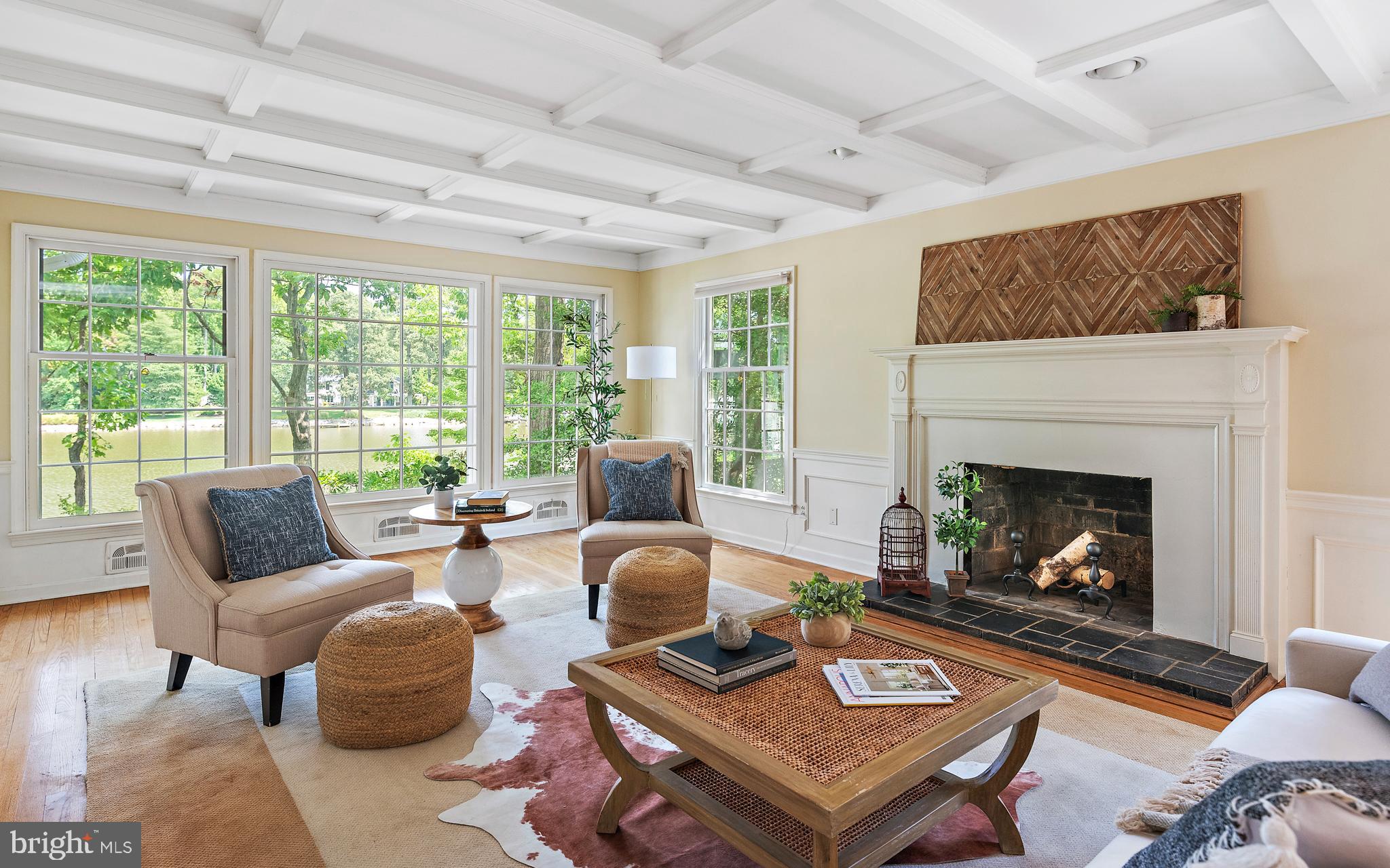 Nestled at the very end of Poplar Lane this charming Coastal home offers privacy within the canopy of trees plus million-dollar views of the creek and surrounding waterfront homes.  Inside, beautiful light resonates from the many windows throughout the house and adds to the easy flow with most of the living space on one level. The present home offers 3 bedrooms and  2 baths on the main level. For buyers looking to expand the home, according to the AA County Health Dept, this home can be expanded 900 sq ft on the existing septic system to accommodate a room above the garage such as a new primary suite with a bath or an additional family room/living space.  Opportunities are endless to reconfigure the rooms to meet a buyer's personal needs.  Or enjoy it just the way it is. Hardwood floors, coffered ceilings, a wood-burning fireplace, and a serene screened porch off the water are only a few of the home's wonderful attributes.  A new hybrid HVAC system with backup furnace, new water heater, and new electrical has been added. The large pier was improved over a year ago and is quite impressive, The expansive dock includes space for entertaining,  a deep water slip and a boat lift on 6-8 ft of protected MLW.     Finally, an oversized  2-car garage with plenty of parking in the driveway makes this a wonderful family home or weekend retreat.. .One way in and one way out, Amberley is a quiet and private waterfront neighborhood with 3 community piers between Whitehall and Ridout Creeks. Additionally, it offers walking paths, fields, and green space, enjoyed by neighbors and pets.  By car easy access to Historic Annapolis,  DC, Baltimore, and the Eastern Shore.  By boat minutes to Annapolis Harbour and the open waters of the Bay.  Broadneck School System