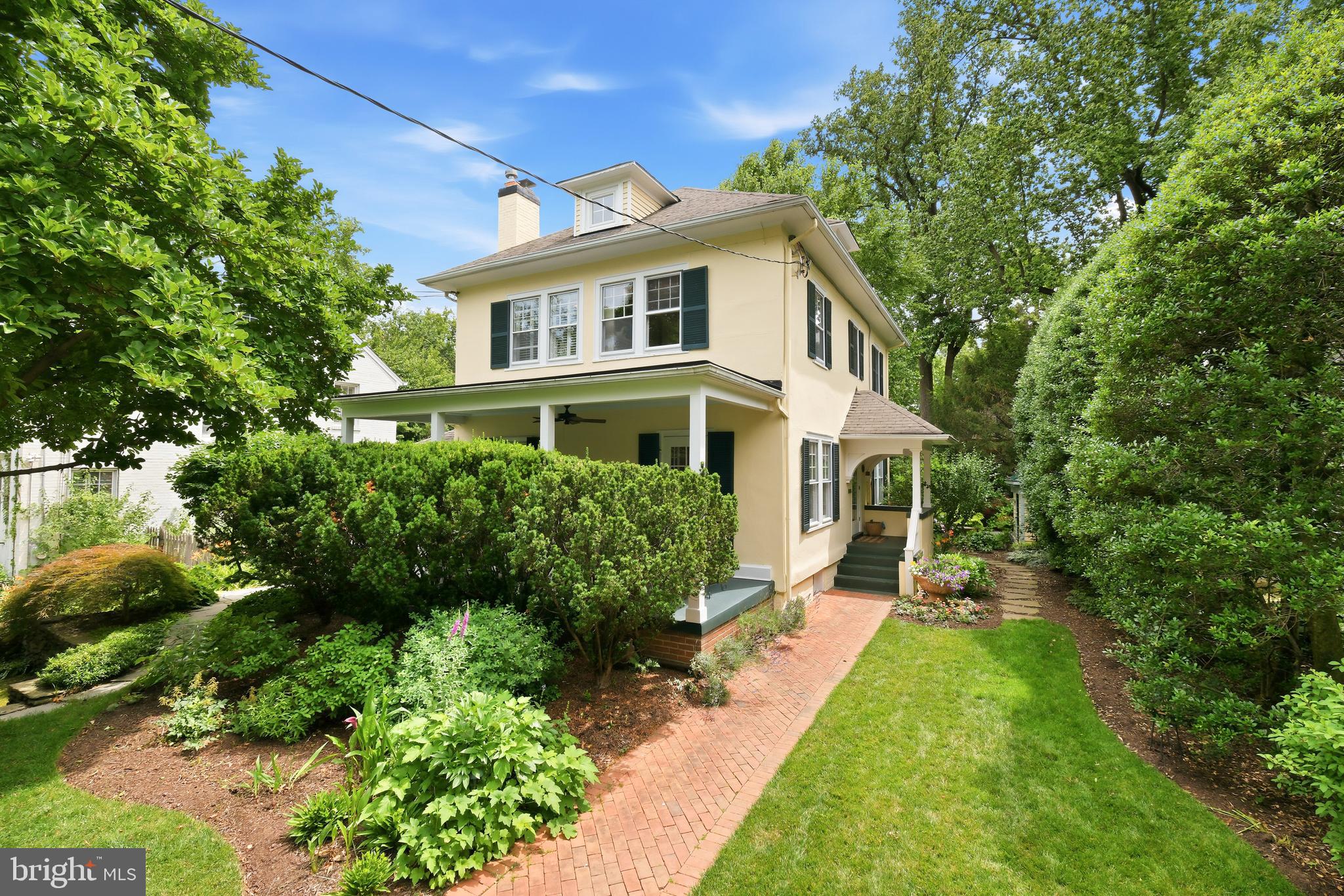 Historically significant and enhanced with exceptional custom updates, 6411 33rd Street Northwest is a distinguished 1917 Sears Roebuck House, catalog No. C251, designated by the Chevy Chase Historical Society and built by John S. DeForest. Located in the sought-after Chevy Chase neighborhood, offering a community feel with all the benefits of living in the nation’s capital - easy access to renowned dining, shopping, nightlife, theaters, parkland, and more! A defining feature of the residence is the thoughtful architectural work completed by the award-winning McInturff Architects, including the kitchen expansion, the dramatic great room addition, and the main level bathroom addition. These improvements bring light, scale, and artistry to the home while respecting its historic character. Mature landscaping, stacked-stone retaining walls, a brick walkway, and a private front veranda create a gracious first impression. Inside, hardwood floors, generous windows, refined millwork, and artisan details establish a polished atmosphere. Notable custom features include Venetian plaster walls in the entryway and upper level, completed through a seven-layer hand-application process; artisan tilework at the living room fireplace; and hand-cut mosaic marble bath detailing. The main level offers a thoughtful balance of traditional and relaxed living spaces. A center-hall entry opens to the formal living room with dentil molding, built-in bookcases, a wood-burning fireplace with custom tile surround, and a glass-paneled door opening to the veranda. Across the hall, the formal dining room features wallcovering, creating an elegant setting for entertaining. The expanded kitchen was designed for function, light, and connection to the outdoors. Highlights include custom windows, granite countertops, recessed lighting, a tile backsplash, a Sub-Zero refrigerator, a Wolf oven and cooktop, and a curved ceiling with a painted mural by celebrated artist Miche Booz, giving the room a memorable architectural identity. A glass door openA glass door opens directly to the rear flagstone patio and backyard, ideal for everyday living and indoor-outdoor entertaining. At the rear of the home, the two-story great room addition creates an impressive gathering space with vaulted and cathedral ceilings, a skylight, custom windows, a second fireplace, two glass doors opening to the patio and garden, and a full bathroom. A loft, stained-glass window, and visual connection to the center-hall staircase landing add character and dimension.  The private backyard is beautifully landscaped. Flagstone patios, exterior lighting, level greenspace, garden beds, manicured plantings, in-ground sprinkler system, and a garden house create an inviting outdoor retreat for quiet mornings, dining, and weekend gatherings. Original hardwood floors continue upstairs, while the Venetian plaster walls extend along the staircase, carrying the home’s refined craftsmanship to the upper level. The primary bedroom includes crown molding, built-in bookshelves, and an en-suite bathroom with a glass-door shower. The hall bathroom is a standout, featuring hand-cut marble detailing, heated marble floors, a high-end vanity, and carefully selected finishes. Two additional bedrooms complete the upper level, each with comfortable proportions and natural light. The unfinished basement provides abundant storage and excellent utility, with potential for wine storage or other specialized uses. Additional upgrades include dual air conditioning systems, a steam furnace, whole-house humidifier for winter, basement dehumidifier for summer, on-demand hot water system, major bathroom renovations, and more - SEE COMPLETE LIST WITH THE DISCLOSURES. Combining historic provenance, numerous architectural enhancements, artisan finishes, generous entertaining spaces, and a private garden setting, 6411 33rd Street Northwest offers a distinctive Chevy Chase residence with enduring character and exceptional livability.