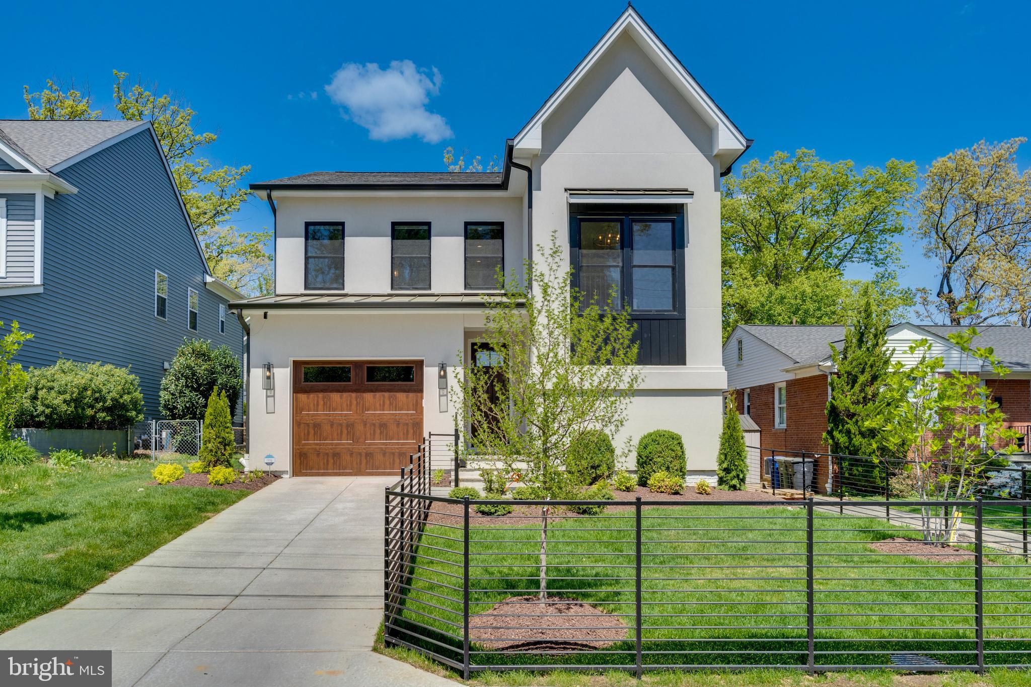 A terrific opportunity to take over a brand-new home that has been further customized with an additional $70,000 in design-conscious improvements.  Prepare to be  stunned by the Dahlia, built in 2023 by Classic Cottages and nestled away in the highly sought-after Carlin Springs neighborhood of Arlington. Boasting four bedrooms and four and a half bathrooms, this home offers approximately 4000 square feet of living space across three finished levels. Elegant, upscale finishes and fine architectural details grace the interior, including high ceilings, beautiful wood flooring, a cozy gas fireplace, clean lines, recessed lighting, and an exceptional quartz chef’s kitchen equipped with top-of-the-line appliances.

The main level welcomes you with a spacious foyer leading to a large open formal dining room adorned with a custom chandelier and dry bar. The stunning gourmet kitchen features a sizable center island and a Jenn-Air appliance suite, seamlessly flowing into the sun-drenched living room with a gas fireplace and access to the private backyard and hot tub. The main level is complete with a powder room and a mudroom with custom cubbies and a pantry off the entrance to the throughly appointed garage.

Upstairs, you'll find three en-suite bedrooms, each boasting a full bathroom and walk-in closet, along with an upper-level laundry. The luxurious oversized primary bedroom suite includes a decadent spa bathroom, a dressing area, and two large walk-in closets.

The finished lower level offers additional living space, featuring a family room with wet bar, a gym, a fourth bedroom, a full bathroom, and mechanical room. Unparalleled quality craftsmanship and exquisite finishes are evident throughout, all situated on a premier lot. THIS HOME CONVEYS WITH:
-Builder's 10-2 warranty
-Newly installed (4/20/2024) 7-seater hot tub
-Owner-installed front and back fences
-Abundant Elfa shelving in garage
-Option to purchase the home FURNISHED, including all gym equipment

Conveniently located with easy access to parks, major commuting routes, shopping, schools, and fantastic dining options, this home offers everything you need for gracious, elegant, and practical living of the good life!