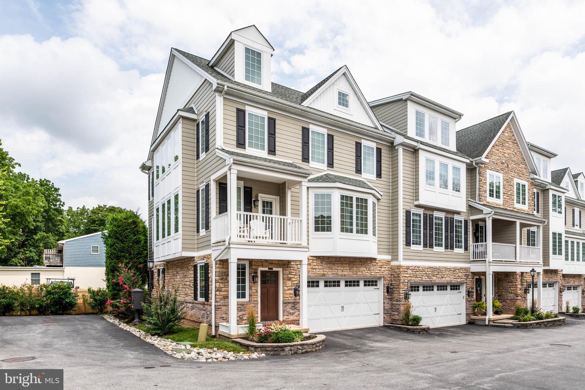 Welcome to 7 Grey Court, where luxury meets convenience in the heart of Berwyn. One of this home's standout features is its coveted end-unit location, filling every space with beautiful natural light.
Step inside this stunning four-level townhome, built just a few years ago, and discover sophisticated, sun-filled living with the perfect blend of modern design, high-end finishes, and everyday functionality.
The first level features a private bedroom suite with a full bath, along with a spacious laundry/mudroom offering access to the rear patio and the attached two-car garage. Designed for both entertaining and everyday living, the main level features 10-foot ceilings and an exceptional gourmet kitchen complete with an oversized marble island with seating for four, Thermador and Bosch appliances, a large pantry, and a built-in microwave. The kitchen flows seamlessly into the spacious living room, highlighted by a gas fireplace, elegant coffered ceiling, and a large bay window that fills the space with natural light. A bright dining area, access to the front balcony, and a convenient powder room complete this level. Retreat to the third floor, where the luxurious primary suite offers a sitting area, two walk-in closets, and a spa-inspired bath featuring a rain shower. An additional bedroom with an en-suite bath and walk-in closet completes this floor. The fourth level features a spacious bedroom with its own en-suite bath, providing the perfect space for guests, a private office, or a bonus living area. Offering four levels of thoughtfully designed living space, this versatile home adapts effortlessly to a variety of lifestyles. Enjoy true lock-and-leave living with HOA services that include landscaping, lawn care, and snow removal. Ideally located, you're just a short walk from Berwyn's charming shops, restaurants, parks, and the YMCA, with convenient access to both the Daylesford and Berwyn train stations for an easy commute. Situated within the highly acclaimed Tredyffrin-Easttown School District, this move-in-ready home offers the very best of Main Line living—exceptional quality, timeless style, and unmatched convenience. Don't miss this rare opportunity to own a modern townhome in one of Berwyn's most desirable communities.