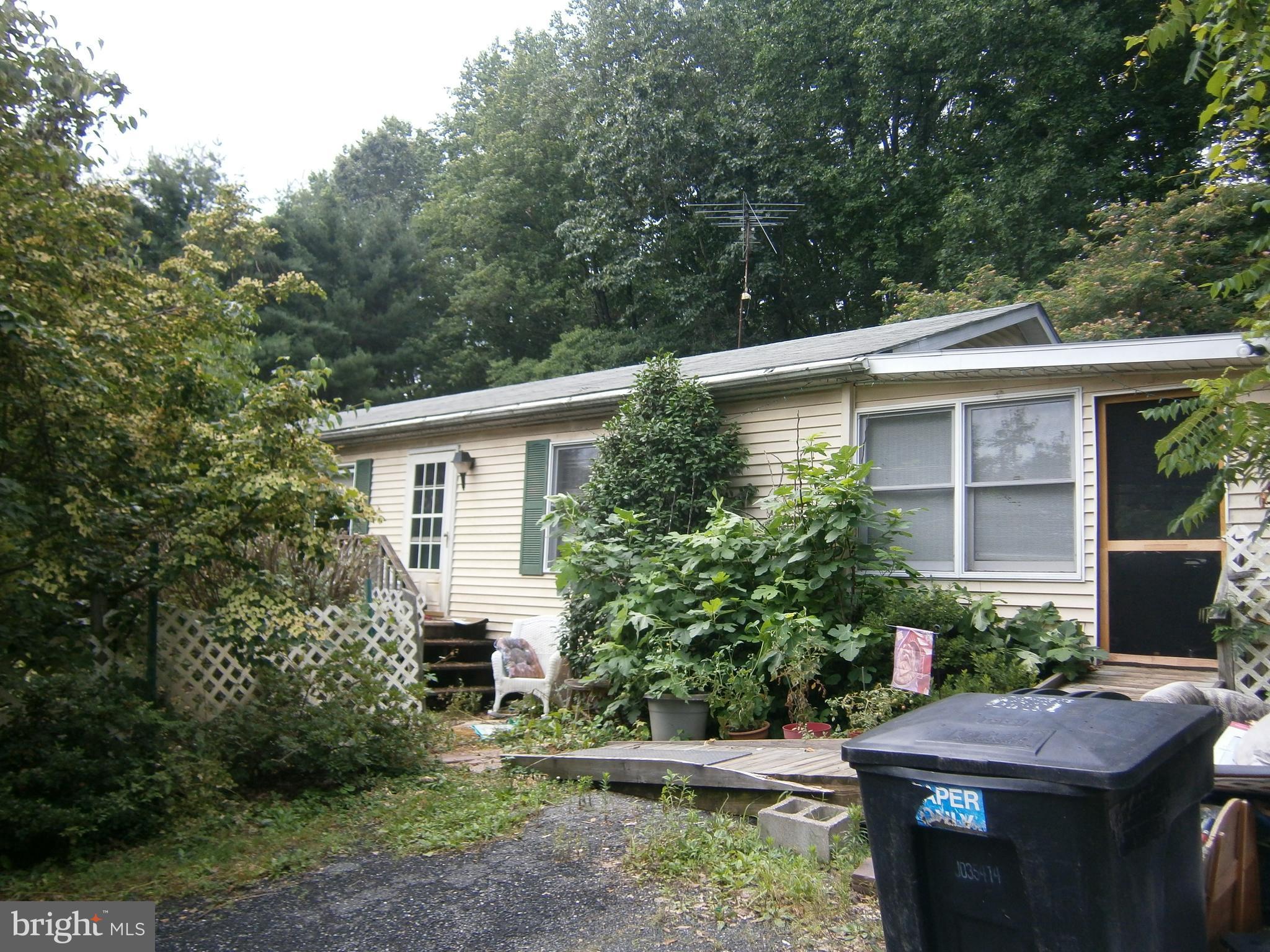 Great Opportunity to own a potential Mini farm!! 2 and a third acres, fenced pastures with electric wires installed, new well, plenty of privacy. Home need lots of TLC, bring you best ideas and make this home a Dream Home for all your family activities and gatherings. horses OK and chickens and more!! Room for everyone includes a pool!! Screened sun room, In-Law suite in the basement so much more