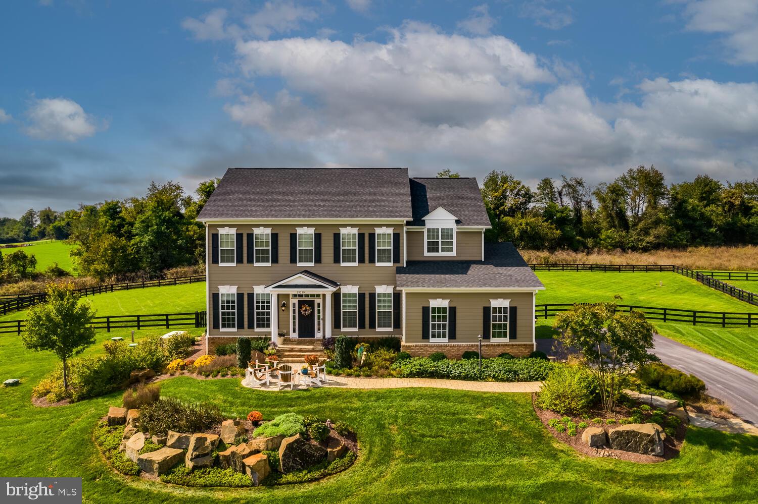 This beautifully designed and lovingly updated 5 bedroom, 4.5 bath home offers a perfect combination of elegance, comfort, and modern convenience, set against a pastoral backdrop amidst impeccable landscaping.

 As you enter, you'll be greeted by gleaming hardwood floors and soaring ceilings that create an inviting atmosphere throughout. The main level features a private office, formal dining room, spacious bedroom with an en suite bath and a grand great room with coffered ceilings and gas fireplace with access to the deck and patio, offering a peaceful outdoor setting perfect for al fresco dining and entertaining. The gourmet eat-in kitchen features granite countertops, custom backsplash, a large center island, walk-in pantry and stainless steel appliances.  A convenient powder room for guests and access to the two car garage completes the floor. 

Upstairs, the primary suite is a true retreat, complete with a oversized walk-in closet and a luxurious en suite bath with soaking tub, water closet and dual sinks. Three additional bedrooms are found on this level, one with its own ensuite bath and two sharing a convenient Jack-and-Jill bathroom as well as the laundry room.

The lower level is waiting for your personal touches, but includes ample storage and a 1500 bottle wine cellar. 

The home boasts several high-end upgrades, including a Generac 48K Whole House Protector Generator, providing peace of mind with automatic diagnostics and exercising modes. It is also equipped with a whole house surge protector and a radon detector for added safety. The RainSoft EC4 water system and Life Ionizer under-sink alkaline water system provide premium water quality throughout the home, ensuring both health and convenience. For those who require seamless connectivity, high-speed internet is installed with Cat 6 wiring in all five bedrooms and the family room, making work and play a breeze. Additionally, an ADT security system offers peace of mind, while Direct TV adds entertainment options.

The stunning outdoor spaces are designed for both beauty and function. The rear landscaping features a stone patio with a large rock accent, an expansive deck, lighting, and lush plantings, including River Birch, Crepe Myrtle, and Japanese Maple trees. The front landscaping includes a stone walk and patio with large boulder retaining walls, providing a beautiful approach to the home. The property backs to a conservation area, offering a private and tranquil setting.

Additional thoughtful enhancements include automated Hunter Douglas window treatments, an invisible dog fence and a 3-board oak wood farm fence with gates that provide privacy and security.

With its stunning finishes, thoughtful upgrades, and serene location, this home is truly one-of-a-kind. It offers everything you need for luxurious living, both inside and out. Welcome home to Skyfield Ridge Pl!