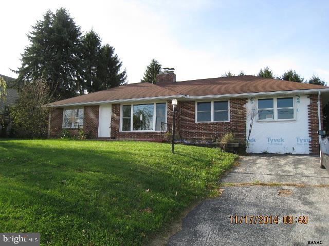 Living room with stone fireplace. Dining area. Hardwood floors. Three bedrooms each with a closet. A bonus room with pull down steps to attic. Off street parking for 5 cars. Level back yard. Shed.