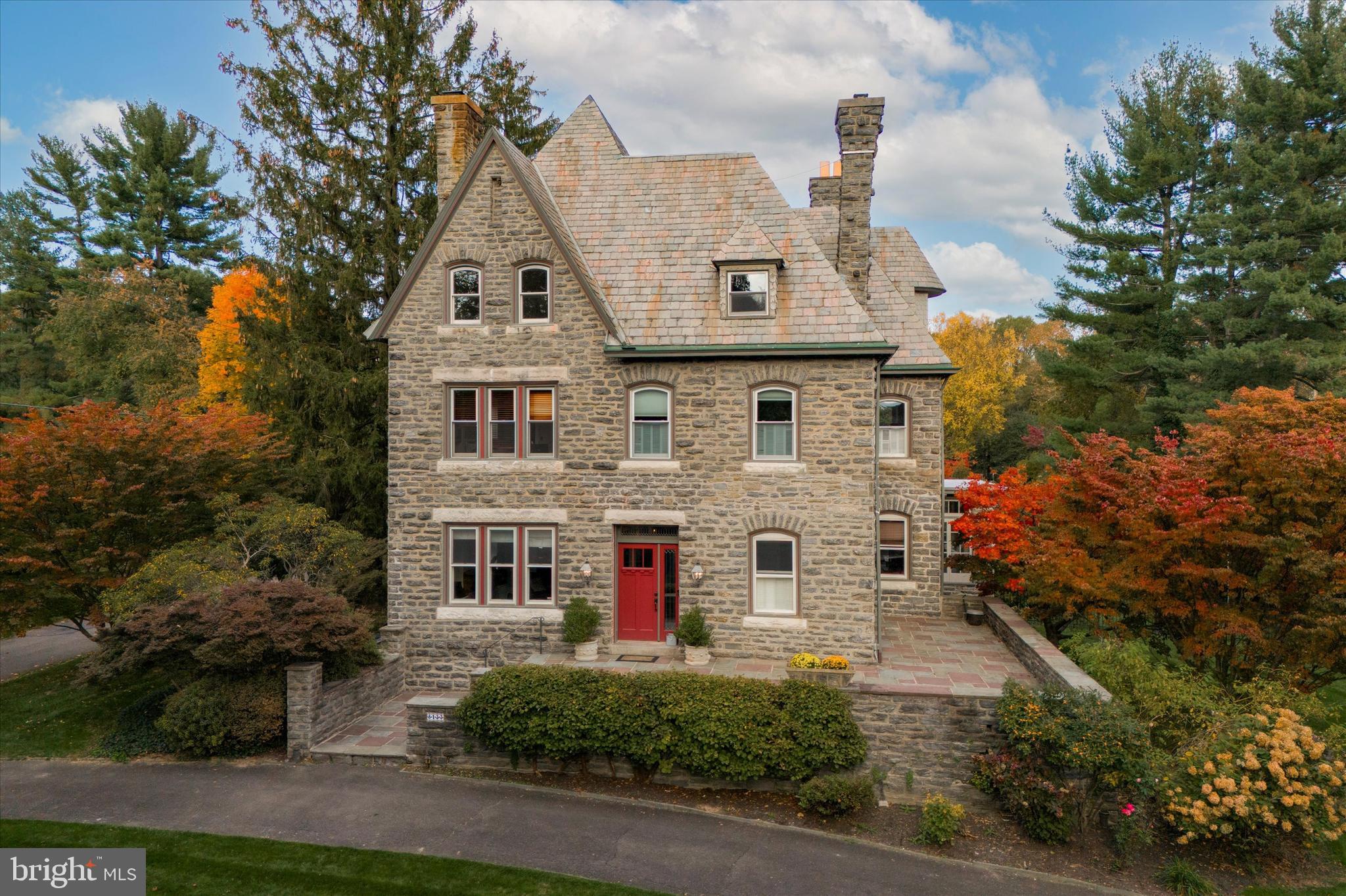 Nestled into the village of Chestnut Hill, this well-maintained and magnificent Queen Anne Victorian style residence was designed in 1889 by the Hewitt Brothers, architects. This distinguished home has a lush front lawn and garden, a circular driveway, and flagstone steps leading to a front terrace and the main entrance.

The entry hall and living room of this residence have 10' high ceilings; the oversized windows offer abundant natural light. There are cozy fireplaces in most rooms and an exceptional floor plan ideal for hosting memorable gatherings. Throughout this captivating residence, you'll discover spacious rooms and a total of seven exquisite tiled and carved fireplaces. Beyond the grand staircase is the dining room with a bay window, an original butler's pantry and an updated kitchen, offering ample storage, granite countertops, and a marble-top island with bar stools. Across from the kitchen is an all-season room that seamlessly extends the kitchen, providing an informal dining area and a comfortable gathering space. The first floor offers additional living spaces, including a wood-trimmed den/media room, a convenient powder room, and a discreet laundry room area that leads to the rear garden, deck and patio.

Ascending to the second floor, you'll find a well-appointed primary suite with its own marble-walled bathroom, dressing room and a spacious bedroom. The next two rooms offer versatility and could easily serve as studies or as additional bedrooms. A second floor laundry room can be found at the rear along with two full bathrooms and a bedroom. This floor truly epitomizes spacious luxury and convenience. The third floor has four bedrooms and two additional bathrooms. Many windows in the house are thermal pane.

Outside, the grounds are a true oasis, featuring an irrigation system for the front and rear lawns, mature perennial flower beds, majestic trees, and an ambiance of privacy. A detached two-car garage with added driveway parking can be found at the rear of the property providing ample space for your bikes and other vehicles.

Seminole Street is one of the most coveted streets in Chestnut Hill due to it's natural and architectural beauty and unparalleled convenience. It is right around the corner from Pastorious Park for dog walks, summer concerts and just a few blocks from Chestnut Hill's vibrant shopping and entertainment district along Germantown Ave. This location also features easy access to the gorgeous foot trails of the Wissahickon Valley and the Valley Green Inn. This grand home is a testament to timeless elegance and modern convenience, and is now ready to welcome its next proud owner. Don't miss the opportunity to make this home yours.
