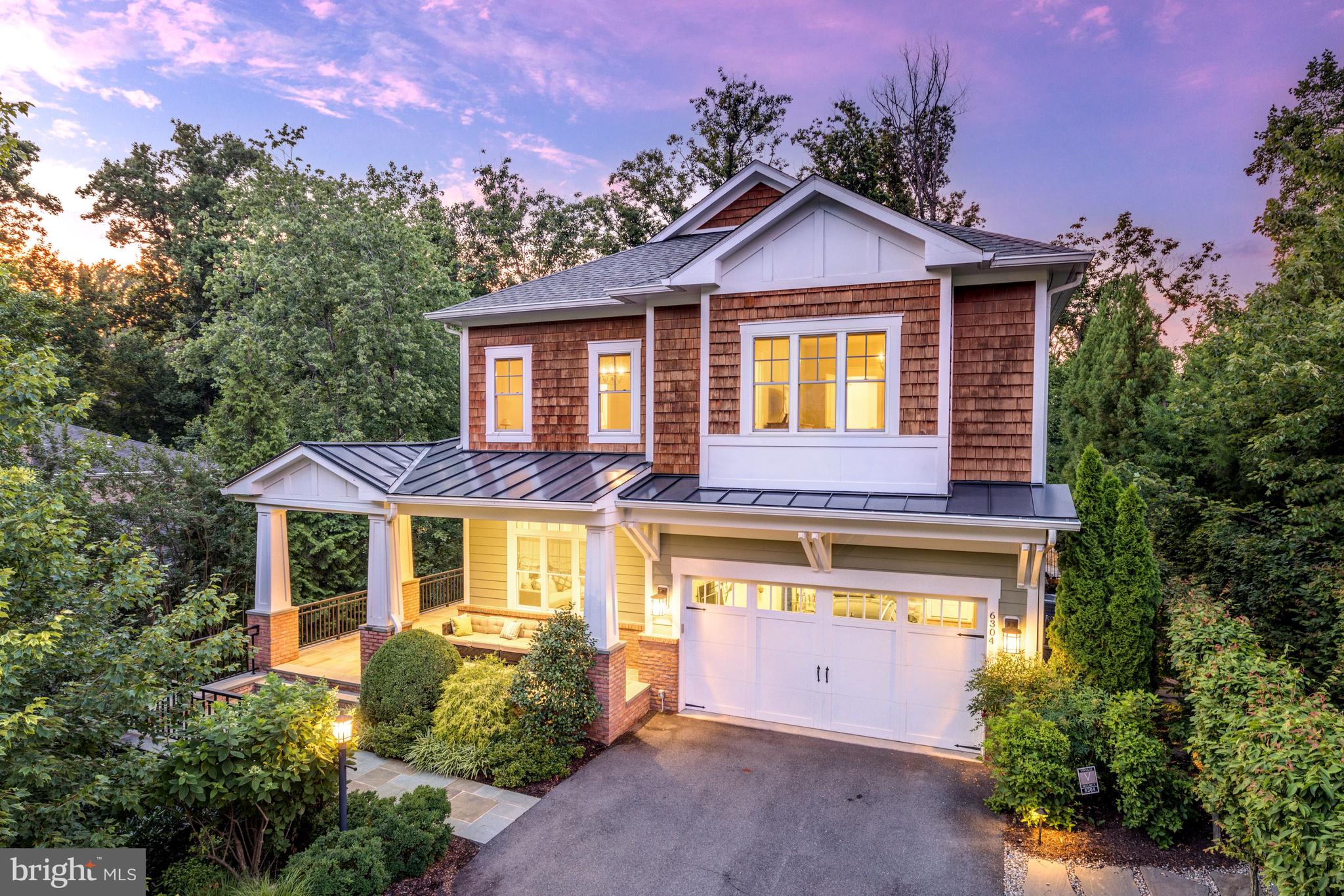This Meticulously designed Craftsman home nestled in the iconic Franklin Park boasts masterpiece landscaping, 5 Bedrooms and 5 ½ Bathrooms on 3 levels spanning nearly 5,000 square feet. As you enter through the inviting hardscaped front porch you are welcomed by a light and airy foyer with hardwood floors throughout the main level. The residence’s traditional floor plan provides effortless flow while maintaining the formality of separate dining and living spaces. Notable design features include Chair Railing, Crown Molding, Recessed Lighting, Wainscotting, Tray Ceilings, Hardwood Flooring throughout the Main Level, and so much more. The beautiful Gourmet Kitchen was completely updated in 2020/2021 with new Subzero French Door Refrigerator, Wolf Double Oven, Wolf Range Top, Bosch Dishwasher, new counter tops and lighting. The connecting Family Room offers a Gas Fireplace & coffered ceiling and direct access to the enviable back Patio that is a dream for entertaining, complete with exterior lighting. The Upper Level offers 4 Bedrooms and 4 en-suite Bathrooms, including the expansive Primary Suite. Primary Suite highlights include hardwood flooring, tray ceiling, a formal Sitting Room, 2 Walk-in Closets and grand en-suite Bath with a soaking tub, separate vanities, and stall shower. The full finished, walkout Lower Level features a large Recreation Room, Den & multi-purpose room, Laundry Room and the 5th Bedroom with adjacent Full Bathroom. There is an abundance of storage space on each floor and the entire home is complete with a Custom Audio/Video System. Outdoor amenities include pristinely maintained hardscaping and landscaping, automatic sprinkler system, enviable covered front porch, a beautiful backyard stone patio with curved stairs to the lower patio, and the fun addition of a play set! This amazing home is located in one of the most sought-after neighborhoods in McLean, with Tyson’s, downtown McLean shopping and major commuter routes all just minutes away. Don’t miss the opportunity to call this house your home!