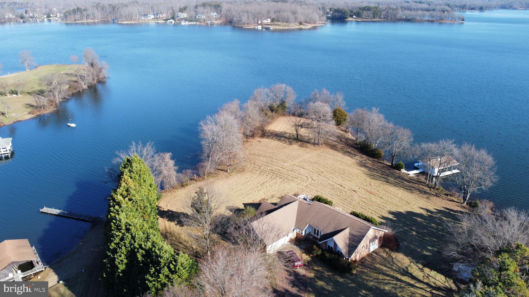 Finding a peninsula lot on the public side of Lake Anna is a rare find! While the interior of the home needs a little TLC, the view couldn't be any better! Come see for yourself.