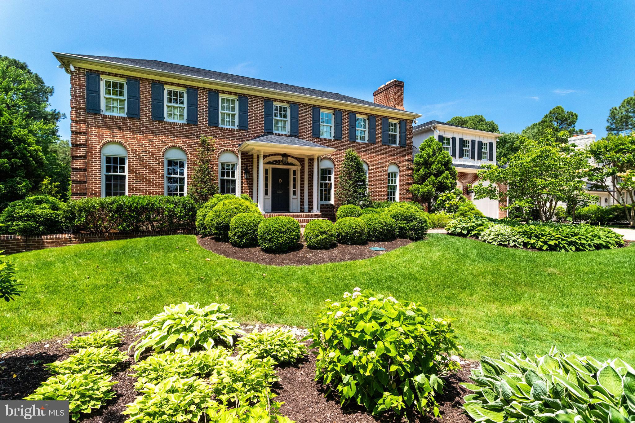 Visiting this property is like stepping into a magical horticultural wonderland.  Designed for something to bloom in every growing season.  A perfect oasis of over 31,500 sf of property complete with decks, terraces, gazebo and custom designed gas fire pit.  Appproximately 6000 sf of living space on three finished levels.  Classic Georgian brick Colonial with a fabulous solarium/sun room with vaulted ceilings overlooking gardens.  Banquet size dining room,  Huge master bedroom suite complete with fireplace in adjacent sitting room and a terrific master bath.  The master bedroom closet size cannot be believed.  Over sized two car garage