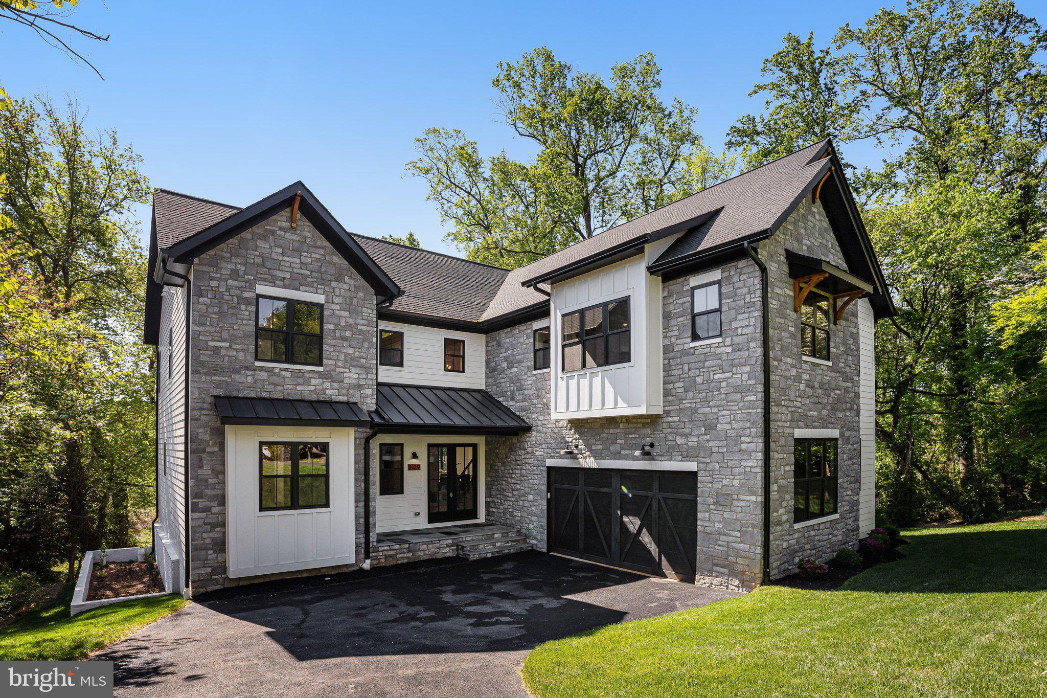 Welcome to this exceptional new construction in the heart of Falls Church, offering 6 bedrooms, 5.5 bathrooms, and thoughtfully designed living on a private .48-acre lot within the sought-after Lemon Road ES, Longfellow MS, and McLean HS pyramid.

From the moment you enter, you’ll be impressed by soaring 10-foot ceilings, stunning white oak hardwood floors, and high-end finishes throughout. The open-concept main level is designed for both everyday living and entertaining, featuring a gourmet kitchen equipped with premium GE Café appliances, custom cabinetry, and an expansive island that seamlessly flows into the spacious family room.

A dedicated main-level office showcases an oversized custom bookcase and elegant shadow box trim, creating a refined and functional workspace. A main-level in-law suite provides additional flexibility for guests or multi-generational living.

Upstairs, you’ll find generously sized bedrooms along with a luxurious owner’s suite designed for comfort and relaxation, highlighted by a jaw-dropping walk-in closet that offers both style and exceptional storage.

The fully finished basement expands your living space with an additional bedroom and full bath, a versatile bonus room perfect for a home theater or fitness space, and an expansive wet bar complete with a refrigerator and dishwasher—serving as the focal point of the lower level and designed for effortless entertaining.

Enjoy seamless indoor-outdoor living with a screened-in Trex deck overlooking the expansive backyard—perfect for entertaining or unwinding in a private setting.

This home is fully equipped for modern living with structured wiring and smart-home readiness, combining timeless craftsmanship with today’s most desirable conveniences.
This is a rare opportunity to own a beautifully crafted home in one of Northern Virginia’s most desirable communities.