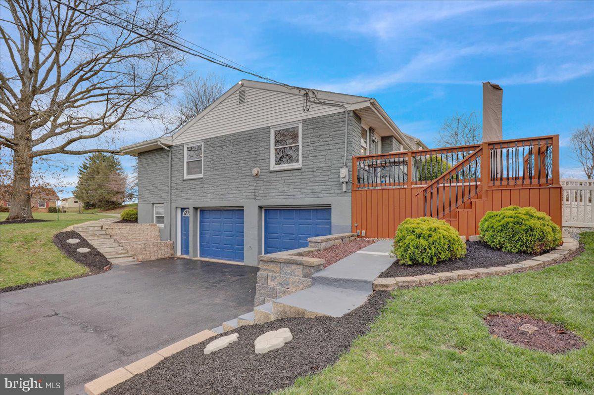 Offer deadline 7pm Monday, April 7th.  Welcome to this beautifully maintained ranch home, perfectly nestled on a spacious .6-acre corner lot.  This 3-bedroom, 2-bathroom gem boasts hardwood floors throughout the main living areas.  Step inside from the covered porch into a bright and airy living space, featuring a living room with a large bay window and recessed lighting that creates a warm and inviting atmosphere.  Decorative columns accent the adjoining dining area which offers ample space for a table, and French doors lead to a 20x15 deck and a fenced-in portion of the yard—ideal for entertaining or relaxing outdoors. The renovated kitchen offers upgraded features such as Corian counters, herringbone tile backsplash, stained glass accents, a double sink and stainless steel appliances. It’s perfect for preparing daily meals or hosting guests!  The main floor includes three bedrooms, highlighted by a generously sized primary bedroom. The second bedroom is spacious, and the third bedroom features brand-new carpet. The main bath has been thoughtfully designed with tile floor,  a double solid surface vanity, tile backsplash and a custom tile tub/shower with grab bars for convenience. The lower level adds even more living space, with a large family room with fireplace, plush carpeting and recessed lighting, a computer/flex area, and a full bath with LVP flooring and a beautiful custom tile walk-in shower.  The attached oversized 2-car garage is impressive - insulated and complete with a large workshop space and an unfinished room that could easily be transformed into a wine cellar, craft room, or whatever you envision.  Additional features include custom blinds throughout, supplemental propane heat &  gutter guards.  This home combines comfort, style, and functionality in a fantastic location.  Don’t miss the chance to make it yours—schedule a showing today!