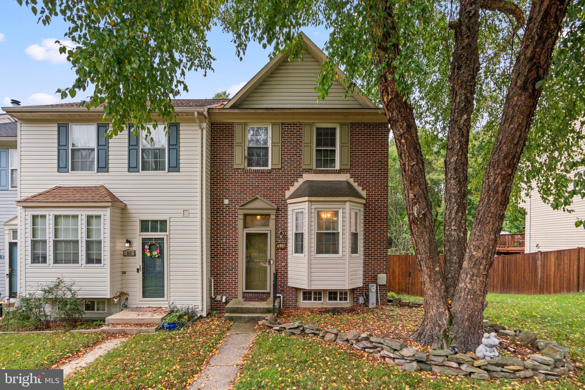 This brick end-unit colonial townhouse offers 1,815 square feet of living space, featuring 3 bedrooms, 2 full baths, and 2 half baths, all situated in sought-after Aspen Park is back on the market with improvements! Step into the foyer and ascend to the open-concept main level, where laminate flooring seamlessly flows through the spacious living and dining room. Elegant crown molding adds a touch of sophistication, while deck access and a stylish powder room offer both convenience and functionality. The eat-in kitchen is highlighted by beautiful bay windows and tile floors, featuring stainless steel appliances, ample white cabinetry, including charming glass-front cabinets, an electric stove, granite countertops, and a convenient pass-through window to the dining room. The owner’s suite boasts high ceilings, plush carpet, a walk-in closet, and an en suite bathroom with a new vanity and a combination shower/bathtub. Two additional bedrooms feature ample storage space, with one bedroom offering built-in bookcases and cabinets for an added touch of character. Another full bathroom completes the upper level. The lower level features laminate floors, backyard access, a half bathroom, and a versatile bonus room, perfect for a home office. French doors open to a deck that steps down to a flat, fully fenced yard with a patio underneath, offering serene, tree-lined wooded views.  Property also features a new hot water heater. Aspen Park is a well-maintained community located just minutes from Lake Waterford Park, where residents can enjoy common grounds, a tot lot, and easy access to outdoor activities like hiking, picnicking, and waterfront recreation along the Chesapeake Bay. It’s also near commuter routes such as Route 100, I-97, and Route 2.