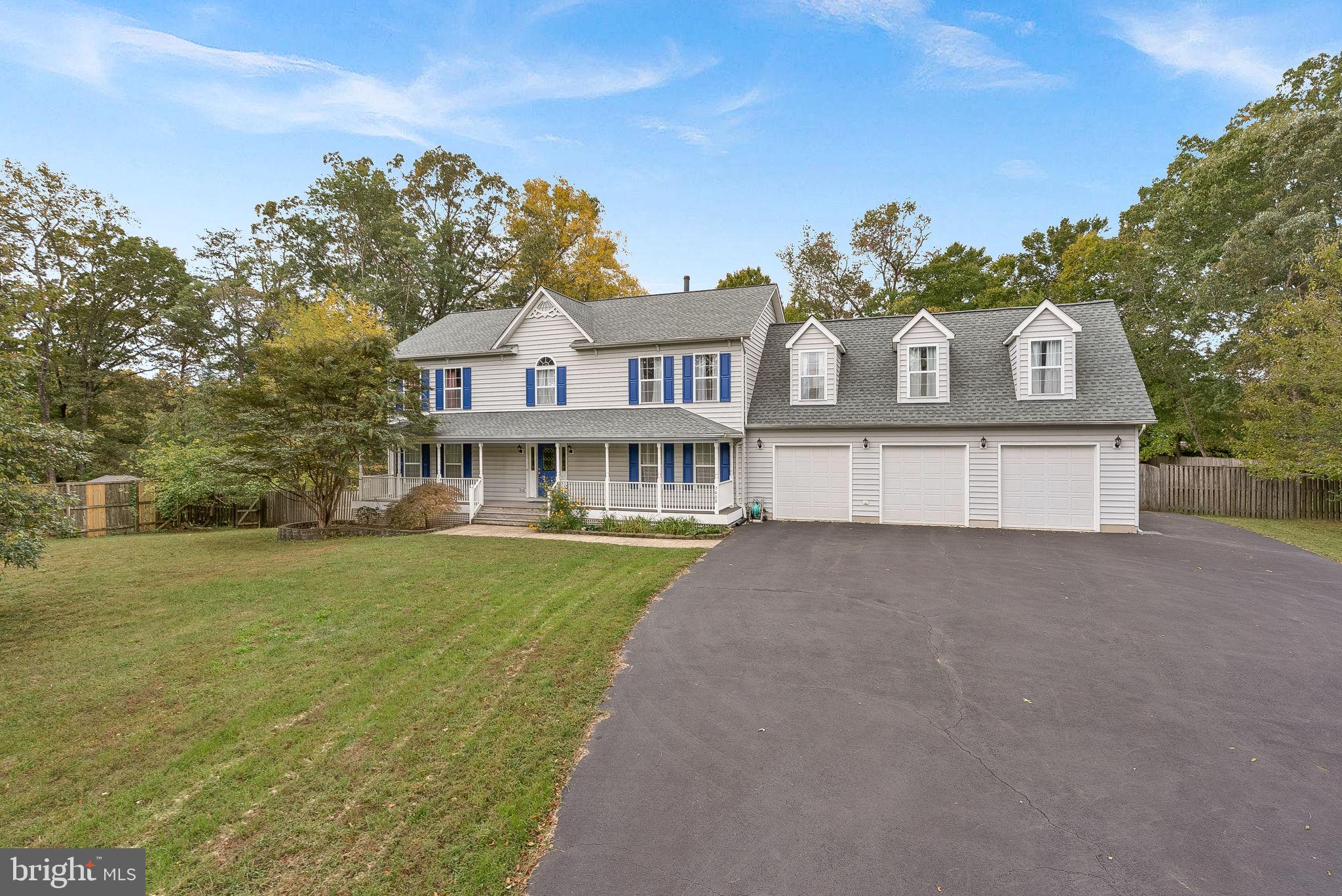 OFFER DEADLINE - Tuesday 4/8.  Get ready to fall in love with the privacy of being set back and nestled among trees on this 1.25 acre lot, with NO HOA and plenty of space to spread out - inside and out! Come in from the welcoming front porch into the foyer with beautiful real hardwood floors. To your left is a large office/den with built in bookcases.  Beyond the foyer is a formal living space that could easily serve as a living or dining room, whatever suits your lifestyle! The sun-filled family room features two wall of built in bookcases and a cozy fireplace. The kitchen has an island and eat in space, leading you outside to the giant composite deck and backyard, complete with a fire pit and ample garden space. Upstairs is a primary suite with multiple closets, a dressing/sitting area, and update private bath with a soaking tub, shower and dual sink vanity.  A doorway leads you to a bonus room off the primary bedroom that runs the entire length of the garage and provides flexibility to use in so many way - craft/art room, reading/library or a media room - and offers a ton more storage space! Also upstairs are three more bedrooms and a full bath. On the walk out lower level you have lots of finished space with a large rec room, laundry room, and full bath, as well as unfinished space for storage and a workshop. Roof replaced in 2024. This property feels a world away from the hustle and bustle of every day life while still being conveniently located near major commuter routes and a few miles from VRE, Historic Old Town Manassas, and Bull Run Park.