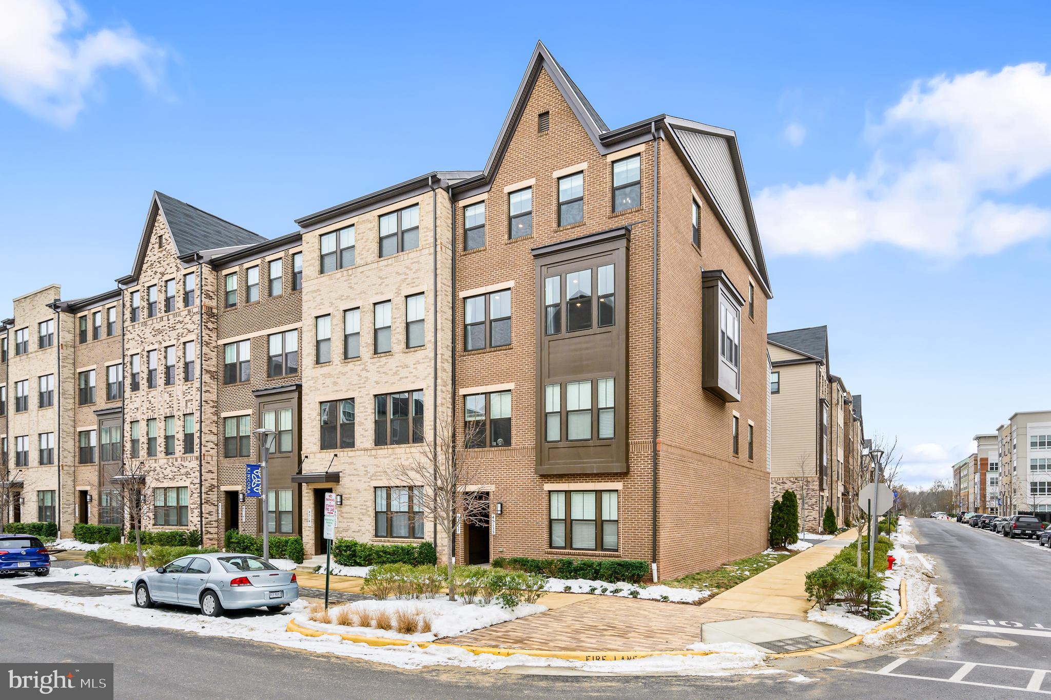 ***PRICE IMPROVEMENT*** Modern and light filled end-unit SMART home in the heart of the desirable Kincora community! This 2,604 sq ft Bluemont model with 3 bedrooms, 2.5 bathrooms and a 1 car garage was built in 2020 and features $39k of upgrades, including: refrigerator with built-in Keurig | all carpeting was replaced with Mohawk, SmartStrand “Forever Clean" carpets over top-grade padding | custom under stairs storage | custom laundry room cabinets and storage | storage shelves in garage | wet bar with beverage fridge and shelving | wood accent wall | industrial light fixtures | barn doors | wide plank luxury vinyl plank flooring | crown molding | tray ceiling.  The kitchen is the heart of the open plan main level.  Gather around the large island in the gorgeous gourmet kitchen with GE Profile appliances, quartz countertops and soft close cabinets or relax in front of the linear gas fireplace with stone surround.  The balcony is perfect for a morning coffee.  Upstairs you will find 3 bedrooms, a convenient laundry room and 2 bathrooms.  The primary suite features  a large walk-in closet, barn doors, tray ceiling, and a spa like bathroom with frameless glass walk-in shower and double vanity.  This property is a SMART home. The GE Kitchen Appliances, GE Laundry Appliances, Schlage Front Door Lock, Resideo Garage Door, Leviton Smart Switches (Lights), Ring Door Bell are all attached to a professional grade Ruckus Managed POE Switched Network with two Wireless Access Points (AP) which are remote managed through Apple or Android devices and are all compatible with Alexa or Google Home for automation. Bring your EV and your charger, the garage has a dedicated 240V outlet ready for your at-home charging station!  Inspired and powered by nature, Kincora offers a one-of-a-kind, interactive community that works in harmony with our beautiful surrounding environment. Explore the winding trails that follow the flowing waters of the Broad Run tributary, enjoy a picnic in lush, growing green spaces or just admire the area’s great blue herons. With 165 acres of hiking trails and preserved, untouched landscape, no other community surrounds you with so much natural beauty.  This address feeds to Loudoun County Public Schools.  Easy access to main roads, shopping, dining, sports, entertainment, the Dulles International Airport, and so much more!