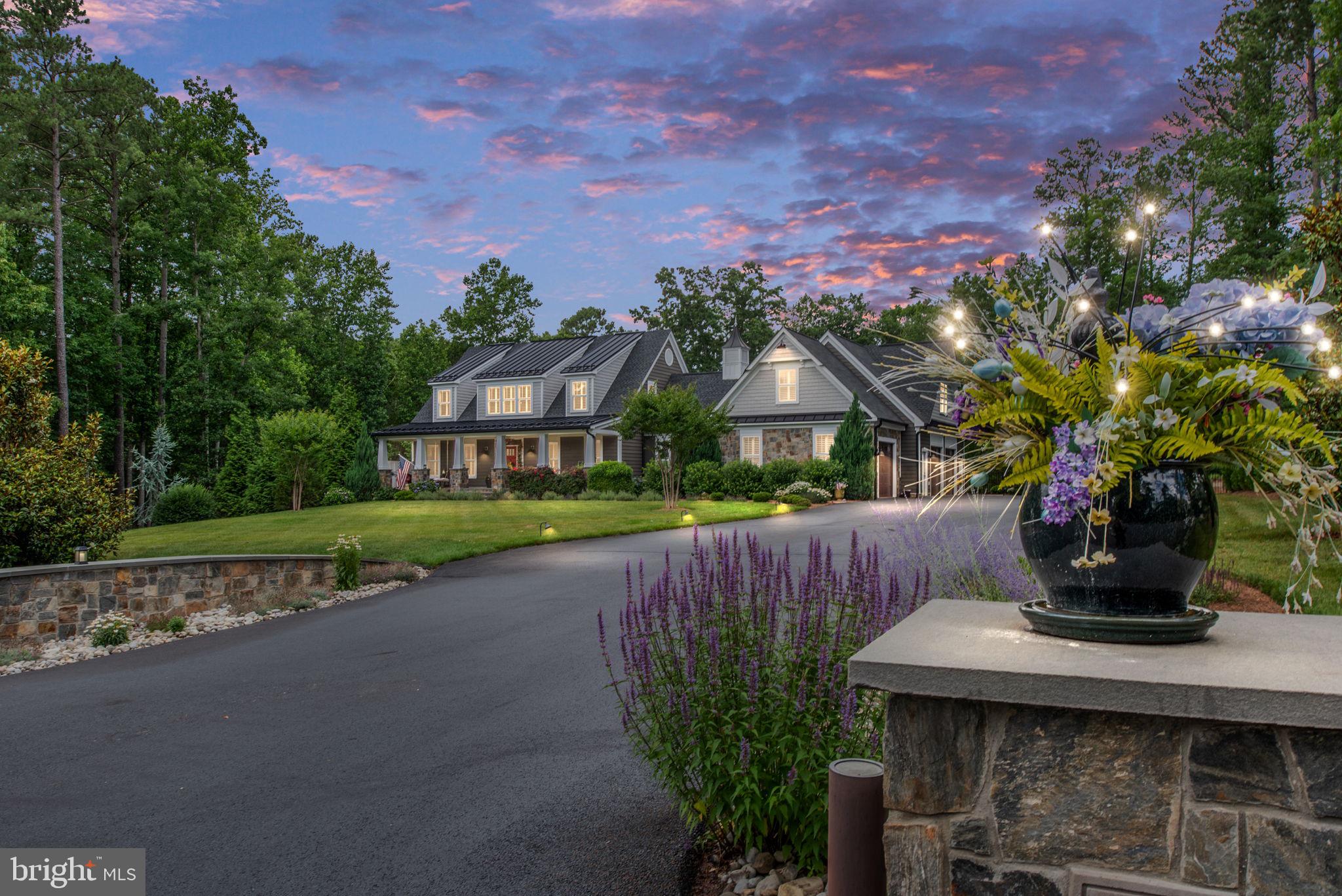 Experience the epitome of luxury living in this breathtaking estate. Designed & constructed by award-winning Mendleson Homes. This ultimate resort-style home is behind the gates of the coveted Fawn Lake. With 5 bedrooms &  6.5 baths, this 6500+ sq ft fully custom Craftsman home features a remarkable layout & sits on one of the community's best & most private 2-acre lots. The layout is perfectly appointed, with a chef's kitchen that opens to the family room, dining room, & rearyard. The backyard is pure magic with gorgeous golf course views of the 7th green, a huge, flat, lush fenced yard with mature landscaping, a raised herb & vegetable garden, an in-ground swimming pool, a custom 6-person hot tub, pool house, with multiple seating & dining areas perfect for entertaining.**Main Home; upon arrival, you will be greeted with a bridge-like driveway designed to host large gatherings with arched stonewalls & monuments. The expansive flagstone porch with stained wood ceiling leads you into this impressive estate. The main level offers a great room with custom built-ins, custom coffered ceiling with shiplap & fireplace, a chef’s kitchen with Thermador, and Kitchen Aid Appliances, 48” 6 burner Thermador gas cooktop with griddle, a commercial grade Thermador Range Hood, (3) additional refrigerator drawers, separate freezer drawer, ice making machine, and wine cooler! The custom kitchen offers an  8’+ custom walnut island and custom quartz countertops, adding warmth and making for the perfect gathering spot. The prep kitchen/butler’s pantry/laundry room is located down the hall from the main kitchen, complete with an oversized commercial refrigerator & freezer, primary bedroom with luxurious en suite with private coffee bar & laundry, large dining room, powder room, and 255 sq ft three-season screen room with cozy gas fireplace leading to rear yard. The upper level has 2 additional oversized bedrooms with private en suites, a separate seating area, a coffee/beverage bar, & a secret passageway between the bedrooms. Finished areas on each side go the dormers allow for the perfect playhouse or storage areas. The lower level offers two additional bedrooms (1 NTC), a full bathroom, a huge rec room/gym area, and two separate storage rooms with shelving. **In Law Suite/Home Office, nearly 800 sq ft located above the garage with a separate entrance. Second full kitchen with bar, stainless appliances, recreation room/meeting room, bedroom/private office suite, & full bath. Don’t miss the secret passageway between the main home and the in-law suite, which is great for storage or hide and seek! **Pool House/Cabana; an aesthetic replica of the main home, offering an outside covered seating area with custom stained wood ceiling and stonewall with flat screen television. This is the perfect use of 400 sq ft. No need to run in and out of the main home. The Pool House has the third private kitchen with w/stainless appliances, a full bathroom, and a separate eating area. The rear of the pool house offers additional storage space. **3 Car Garage; 1296 sq ft fully finished, custom sink & cabinet area, built-in tiled doggie shower. Fully insulated garage doors & walls, as well as a private driveway entrance into the In Law Suite/Home Office. Complete with Fully Set Up and Installed Golf Simulator. **Outdoor; in-ground pool, hot tub, sundeck w/pre piped connection for gas grill & pass-thru window, full irrigation system, golf course views, patios, walkways, separate yard hydrant  for filling pool & watering plants. **Additional Notable Features; 500 gallons propane tank, 280-foot deep well that delivers 50 gallons of water per minute, window candles w/ timers, dusk to dawn lighting, 3490 sq ft patio around pool, shiplap throughout, two-piece cove molding, customizedCubbie areas, custom plantation shutters, 3 total kitchens, 10 total refrigerators, 3 separate laundry areas. ** Private Lake, 18-hole Arnold Palmer Signature golf course, Pool, Gym+++