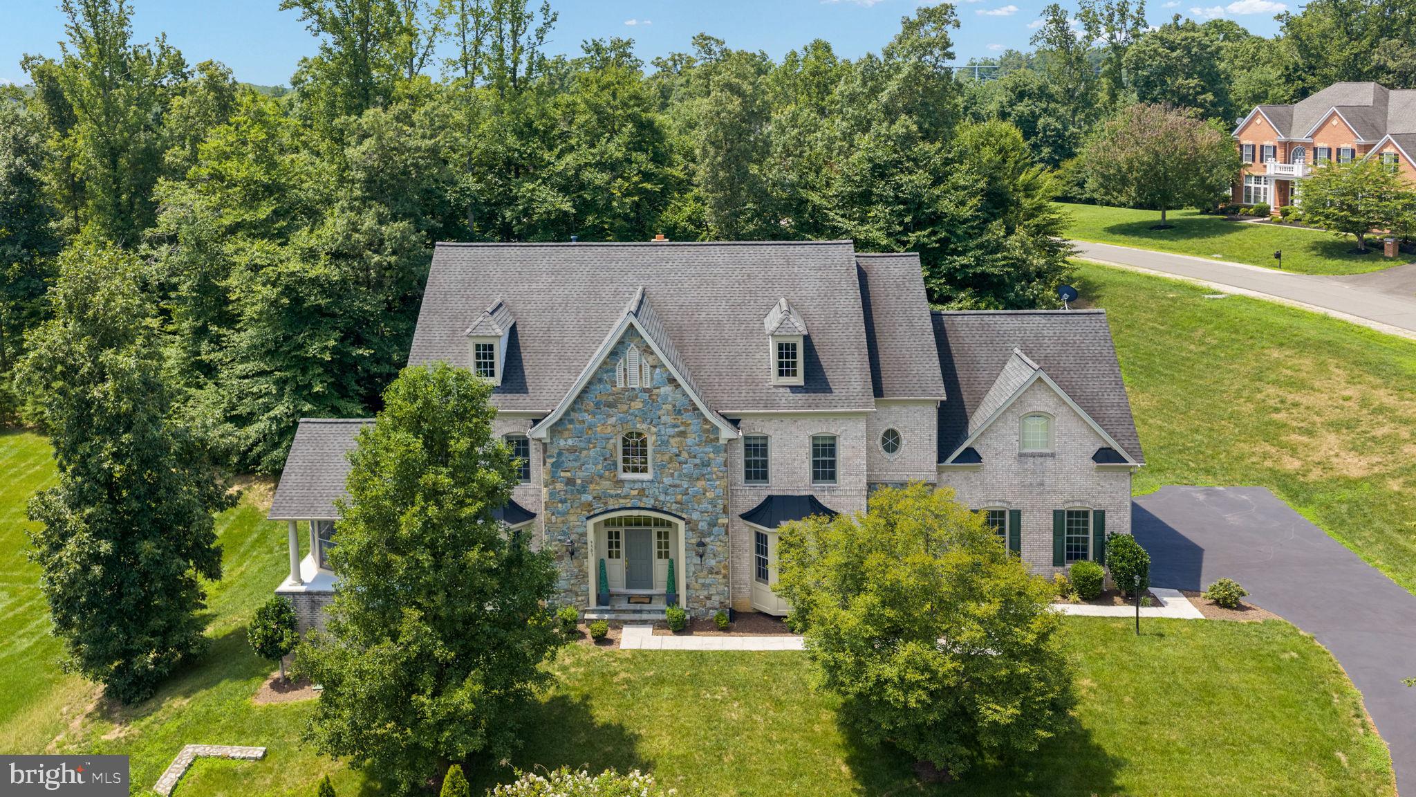 Professional Photos Coming Soon! Welcome to this exceptional former Craftmark model home, perfectly situated on a beautiful 1.2-acre estate lot with ample room to add your dream swimming pool. Surrounded by mature trees and park like setting offering beauty privacy and a beautiful setting. Convenient school bus stop located right outside the home- ideal for families. Offering over 9,000 square feet across four finished levels, this impressive residence features 6 bedrooms, 6 full bathrooms, and 1 half bath.

Step inside to a dramatic two-story foyer and soaring 24 ft high ceilings, creating an open, light-filled layout with abundant natural light throughout. The main level features a private office, an elegant conservatory, formal living and dining rooms, and a gourmet chef’s kitchen with Viking appliances, a large center island, and seamless flow into the spacious family room.

Every bedroom is generously sized with walk-in closets and spacious bathrooms. The luxurious primary suite offers a spa-inspired bath and an expansive owner’s retreat. The fourth level provides a finished attic, ideal for a playroom, studio, or additional flex space.

The fully finished walk-out basement includes a recreation area, theater room, and a sixth bedroom with a full bath, making it perfect for guests or multigenerational living.

Major updates include three new HVAC systems (2024), roof replacement (2019), water heater (2021), and new basement flooring (2025).

The theater room furniture and equipment, Additional furnishings, including the conservatory sofa, are available for purchase upon request.

A rare opportunity to own a meticulously maintained luxury home offering space, elegance, and timeless Craftmark quality. Professional photos coming soon!