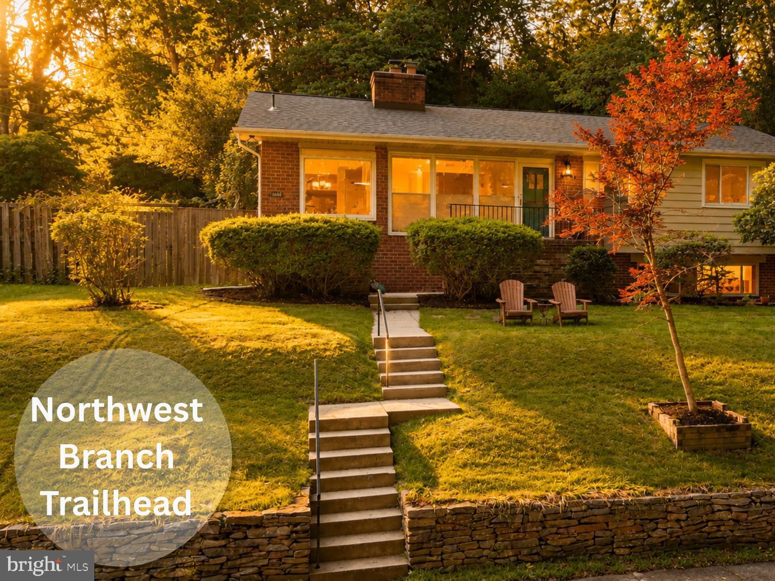 Don't hike to this property, run. Two living spaces. Two kitchens. One great home.

Tucked away at the end of a quiet street with the Northwest Branch Trailhead and a babbling stream just outside the front door, this mid-century modern retreat offers a lifestyle that is increasingly hard to find. Surrounded by nature yet minutes from Metro, shopping, dining, and major commuter routes, this 4-bedroom, 3-bath home is the perfect balance of privacy and convenience.

Inside, timeless mid-century design shines through vaulted ceilings with exposed wood beams, hardwood floors throughout the main level, and walls of windows that flood the home with natural light. The spacious living room centers around a cozy fireplace, while the beautifully updated tiled sunroom creates the perfect space to relax and enjoy the changing seasons. The bright kitchen features granite countertops, a gas stove, side-by-side refrigerator with ice maker and water filter, and a charming window seat overlooking the wooded ravine.

The Forest Knolls Pool is a beloved neighborhood amenity and a favorite destination for residents during the summer months. Its convenient location and strong sense of community make it one of the area's most cherished features.

The recently renovated garden-level suite offers exceptional flexibility with its own private entrance, kitchenette, built-in workspaces for two, full bath, and separate living area, making it ideal for guests, extended family, remote work, or potential income opportunities.

Step outside to enjoy the deck and patio overlooking mature trees and lush landscaping. In the spring, the property comes alive with colorful azaleas and daffodils. Whether you're enjoying your morning coffee while listening to the stream, hiking or biking miles of nearby trails, or simply unwinding in the peaceful surroundings, this home feels like a private nature preserve.

Located within walking distance of Forest Knolls Elementary School, Forest Knolls Community Pool, and North Four Corners Park, and just minutes from Trader Joe's, Safeway, Woodmoor Shopping Center, downtown Silver Spring, and both the Silver Spring and Forest Glen Metro stations. Easy access to I-495, Colesville Road, and University Boulevard makes commuting a breeze.

A rare opportunity to own a distinctive mid-century modern home where nature begins at your front door and every day feels like a getaway.
