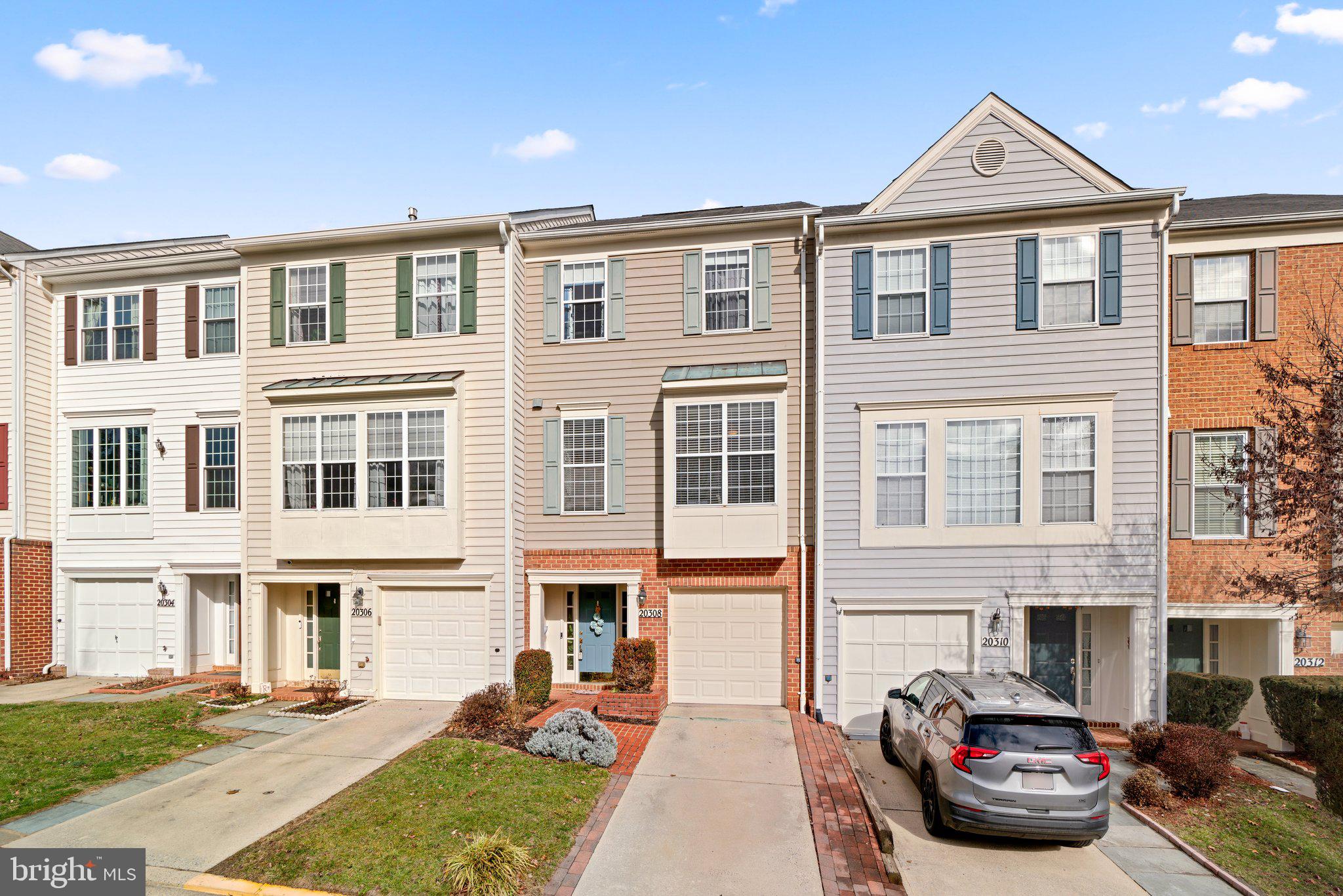 OFFER DEADLINE: MONDAY FEB 5 @ 4PM. This is the one you've been waiting for! Absolutely beautiful garage townhome in Montgomery Village.   The first level is full of light and possibility, with room to greet your guests and a versatile family room in back.  The patio doors let in the light and lead to your private patio. You will also find a full bath giving you lots of options for use.  Head upstairs to the main level featuring hardwood floors, tall ceilings and more large windows, letting in the light. Entertain on the deck or enjoy a quiet cup of morning coffee; there are no homes behind you, just green space. Step into the huge kitchen with 42" cabinets, stainless steel appliances, granite countertops and recessed lighting.  There is even a powder room tucked away for guests. Retreat upstairs to the private areas of the home, where the hardwood floors continue. The primary suite boasting tons of light, a vaulted ceiling, its own ensuite bath and walk-in closet. Two more generous bedrooms, a second full bath and laundry complete the top floor. There is ample space to park with your garage, an additional spot in driveway behind garage, and even more guest parking. You are ideally situated within the Montgomery Village community, tucked away in a newer neighborhood within the larger community, but with access to all that Montgomery Village has to offer including 7 pools, picnic areas, basketball courts, bike trails. Get ready to see it soon because it will not last!