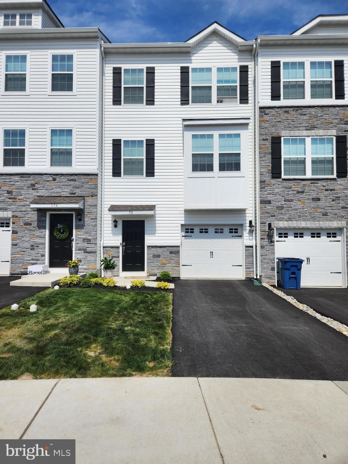 Welcome to this new Lafayette Model townhome, offering 1,996 square feet of thoughtfully designed living space across three finished levels in the highly desirable Pennridge School District. This is your opprotunity for new construction without the wait and below current builder pricing!!!!   Combining modern finishes, spacious living areas, and a convenient location, this home delivers both style and functionality. The entry level features a welcoming foyer with direct access from both the front door and attached one-car garage. A large finished recreation room provides the perfect space for a family room, home office, gym, or media area, with sliding glass doors leading to the rear yard for added indoor-outdoor living. The main level showcases an open-concept floor plan with luxury vinyl plank flooring throughout. The spacious living and dining areas flow seamlessly into the beautifully appointed kitchen, featuring quartz countertops, stainless steel gas appliances, 42-inch cabinetry, a walk-in pantry, a large center island with breakfast bar seating, and a breakfast nook. Sliding glass doors open to a private Trex deck, ideal for morning coffee, outdoor dining, or entertaining guests. A convenient powder room completes this level. Upstairs, the third floor offers three generously sized bedrooms, a hall storage closet, and a dedicated laundry room with overhead cabinetry. The primary suite serves as a private retreat with a large walk-in closet and a luxurious en-suite bath featuring dual vanities and a step-in shower. Two additional bedrooms share a well-appointed hall bath with a tub/shower combination. Located in a beautiful new community featuring a children's playground and convenient access to Routes 309, 663, and the Pennsylvania Turnpike, this home offers an exceptional lifestyle with easy commuting options. Don't miss this opportunity to enjoy new construction, modern amenities, and low-maintenance living in a beautifully designed townhome. Schedule your private tour today!