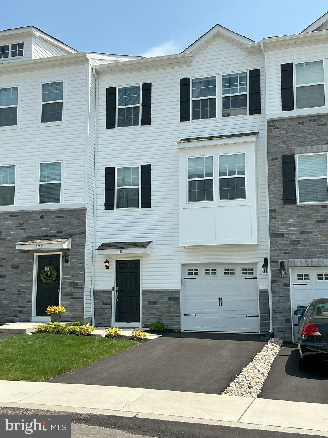 Welcome to this new Lafayette Model townhome, offering 1,996 square feet of thoughtfully designed living space across three finished levels in the highly desirable Pennridge School District. This is your opprotunity for new construction without the wait and below current builder pricing!!!!   Combining modern finishes, spacious living areas, and a convenient location, this home delivers both style and functionality. The entry level features a welcoming foyer with direct access from both the front door and attached one-car garage. A large finished recreation room provides the perfect space for a family room, home office, gym, or media area, with sliding glass doors leading to the rear yard for added indoor-outdoor living. The main level showcases an open-concept floor plan with luxury vinyl plank flooring throughout. The spacious living and dining areas flow seamlessly into the beautifully appointed kitchen, featuring quartz countertops, stainless steel gas appliances, 42-inch cabinetry, a walk-in pantry, a large center island with breakfast bar seating, and a breakfast nook. Sliding glass doors open to a private Trex deck, ideal for morning coffee, outdoor dining, or entertaining guests. A convenient powder room completes this level. Upstairs, the third floor offers three generously sized bedrooms, a hall storage closet, and a dedicated laundry room with overhead cabinetry. The primary suite serves as a private retreat with a large walk-in closet and a luxurious en-suite bath featuring dual vanities and a step-in shower. Two additional bedrooms share a well-appointed hall bath with a tub/shower combination. Located in a beautiful new community featuring a children's playground and convenient access to Routes 309, 663, and the Pennsylvania Turnpike, this home offers an exceptional lifestyle with easy commuting options. Don't miss this opportunity to enjoy new construction, modern amenities, and low-maintenance living in a beautifully designed townhome. Schedule your private tour today!