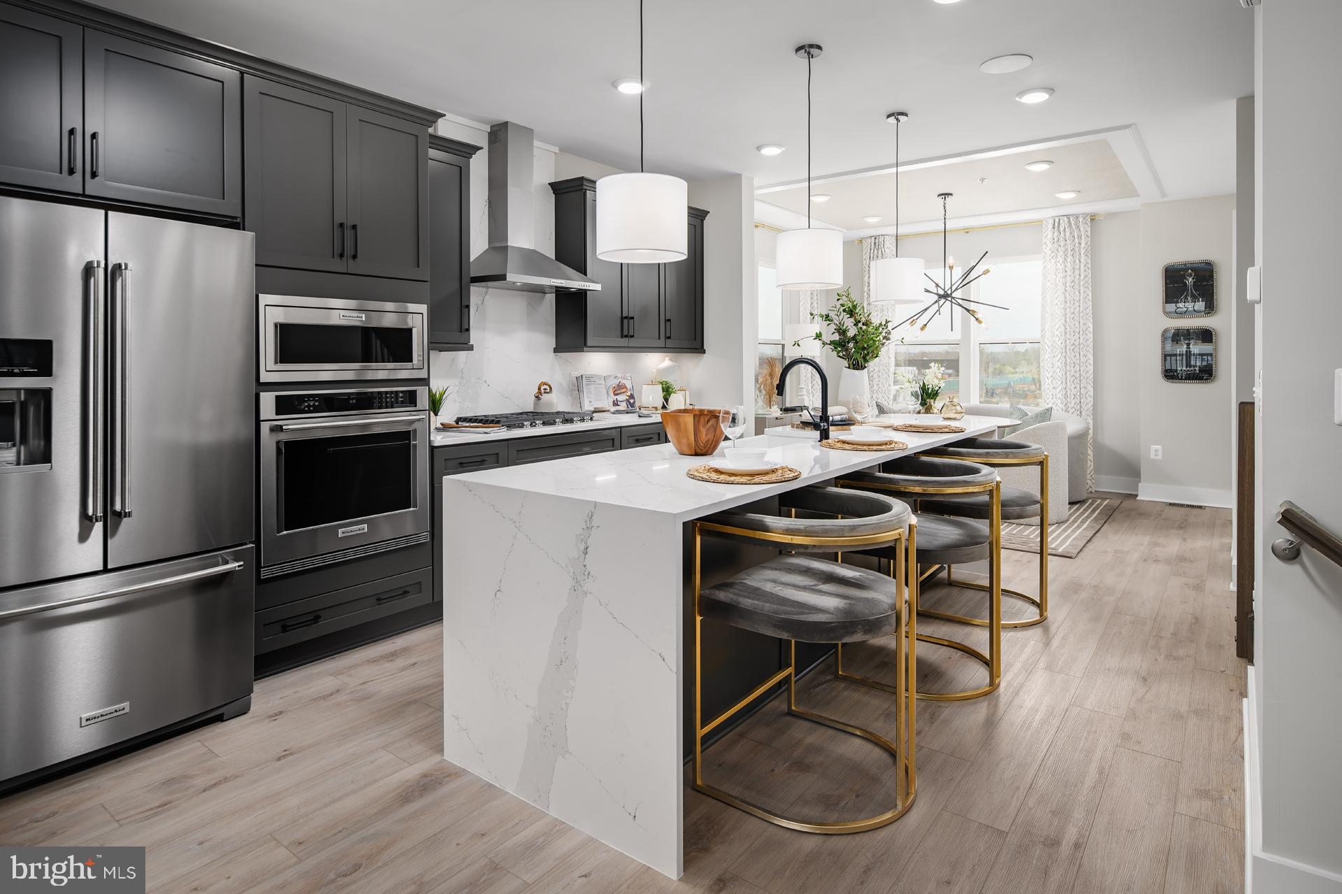 Discover the DRB Advantage with up to $50,000 in DRB Flex Cash on contracts ratified by 4/30/26!  WITH USE OF APPROVED LENDER AND TITLE! Lower your price, cover your closing costs, or buy your rate down**
Welcome to the Rockland, an open-concept luxury townhome with modern finishes and an urban aesthetic! Enter the home through the main entryway or the rear load 2-car garage, both leading into a spacious recreation room that can be converted into an enclosed bedroom or study and full bathroom. Ascending to the second level, you will discover the main living space comprised of a sunlit family room, a generously sized kitchen, and a dining room complete with a sliding glass door and rear deck access. With an oversized island and optional gourmet kitchen upgrade, this space is truly chef worthy. When it's time to relax, retreat to the primary suite, a private getaway that can be found on the third level of the townhome. With an optional dropped tray ceiling and large walk-in closet, this suite is the perfect place to unwind. The spa-like bathroom features dual vanity sinks and a seated shower. What's more? For ultimate relaxation, you can upgrade to a roman shower with dual shower heads or a soaking tub. The laundry room is also located on the third level, conveniently accessible from the primary suite and secondary bedrooms. Enjoy stunning views from the fourth level's loft deck, a private outdoor living area perfect for entertaining. Flexible by design, the fourth level offers an optional secondary bedroom and full bathroom or second primary suite with open entertaining, recreation, or flex space, and ample storage closets. With countless opportunities to customize, the Rockland has something for everyone. ***THIS PROPERTY MAY QUALIFY FOR THE BROWNFIELD TAX CREDIT. WHICH COULD RESULT IN UP TO A 70% REDUCTION IN ANNUAL CITY PROPERTY TAXES FOR TEN YEARS***  See sales consultant for more information. *Photos may not be of actual home. Photos may be of similar home/floorplan if home is under construction or if this is a base price listing.