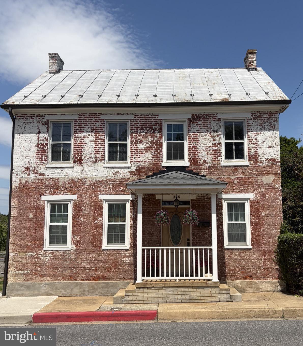 Step back in time with this charming Civil War-era brick home in the heart of historic Boonsboro, Maryland. Situated on a rare double lot, this 4-bedroom, 1-bath residence is rich in timeless character, enduring craftsmanship, and endless potential.
Lovingly maintained by its longtime owners, this historic home offers solid "good bones" and is ready for its next chapter. Original architectural details reflect its rich history, while a few of the rooms have been freshly painted, providing a fresh, inviting feel while preserving the home's classic character. The spacious walk-up attic provides abundant storage or the opportunity to create additional finished living space.

Thoughtful updates include two HVAC systems installed in 2018 and 2020, providing improved comfort and efficiency. The home is connected to public water and sewer, offering the convenience of modern utilities.
Outside, the beautifully maintained oversized yard is a true standout, offering ample space for gardening, entertaining, outdoor recreation, or future expansion. Two mature magnolia trees grace the backyard, creating a picturesque setting with stunning seasonal blooms and welcome shade. The rare double lot provides flexibility and privacy that are seldom found in downtown Boonsboro.
Don't miss this rare opportunity to own a piece of Boonsboro history!