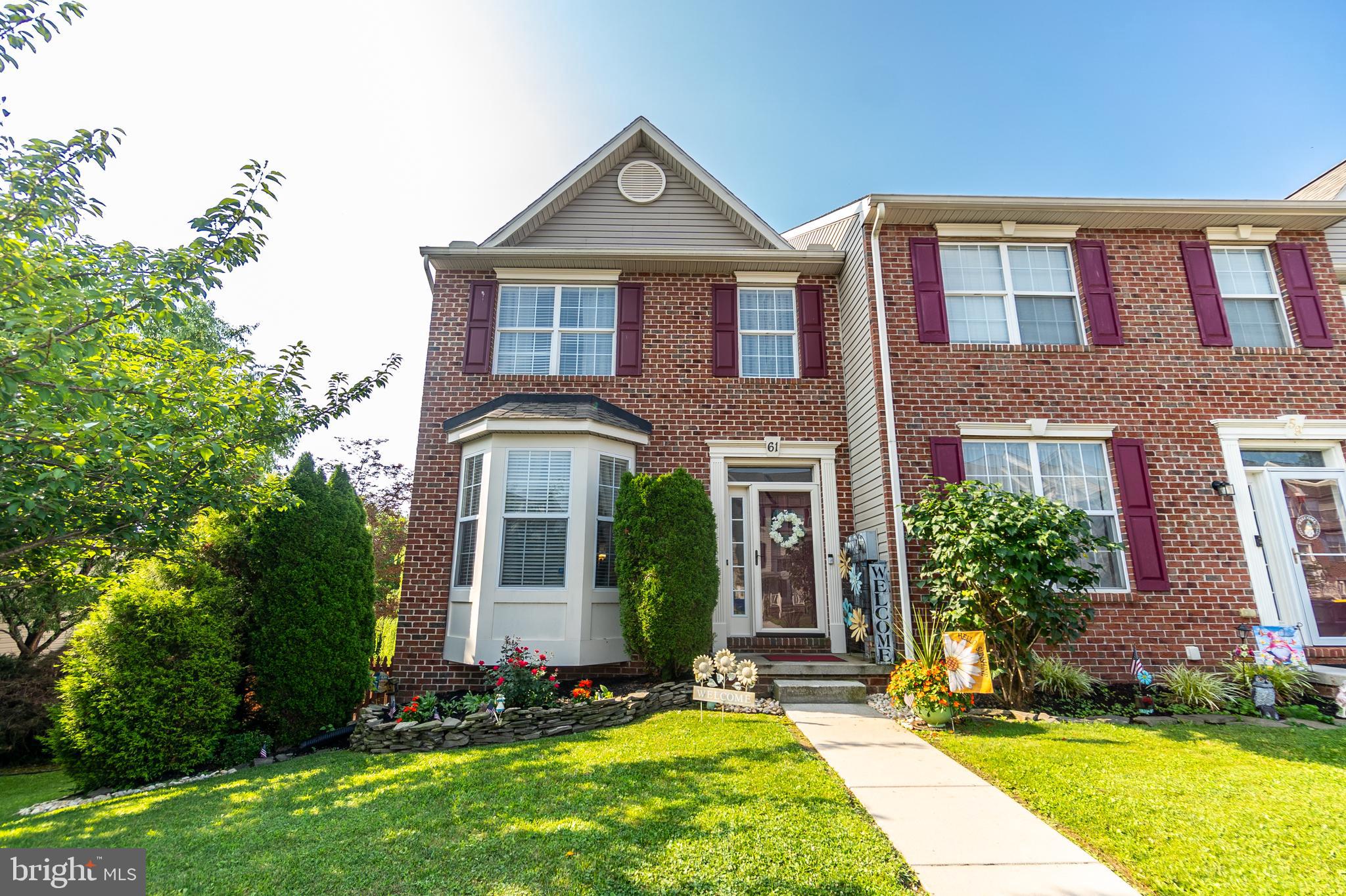 Stunning, better than new, brick end unit townhome.  This home has been meticulously cared for by the sellers and it shows.  Step inside the home and fall in love with the beautiful floors that carry throughout the 1st floor.  The big bow window in the living room lets in lots of natural light keeping this room bright and cheery.  The beautiful kitchen features an eat at island, granite countertops, big dining area, and a pantry.  The half bath on this level is an added convenience.  Upstairs, the owner's suite will steal your heart and the ensuite will make you feel like you've entered your own spa, with the deep soaking tub, just waiting for you to melt the cares of the day away.  There are 2 more perfectly sized bedrooms on this level and a nice sized full bath.  The lower level is where all the fun is, with a big rec room just waiting for movie nights, a pool table or a night of games and cards is definitely in the future for the lucky buyers.  There is even a bonus room on this level that could easily be used as an office.  Out back you have the deck off the kitchen, and the lower level covered patio with ceiling fan for comfort on those hot days.  The backyard is huge with lots of room to run around in and it's already fully fenced in!  Off street parking, pretty landscaping finish up this spectacular MUST SEE home!!