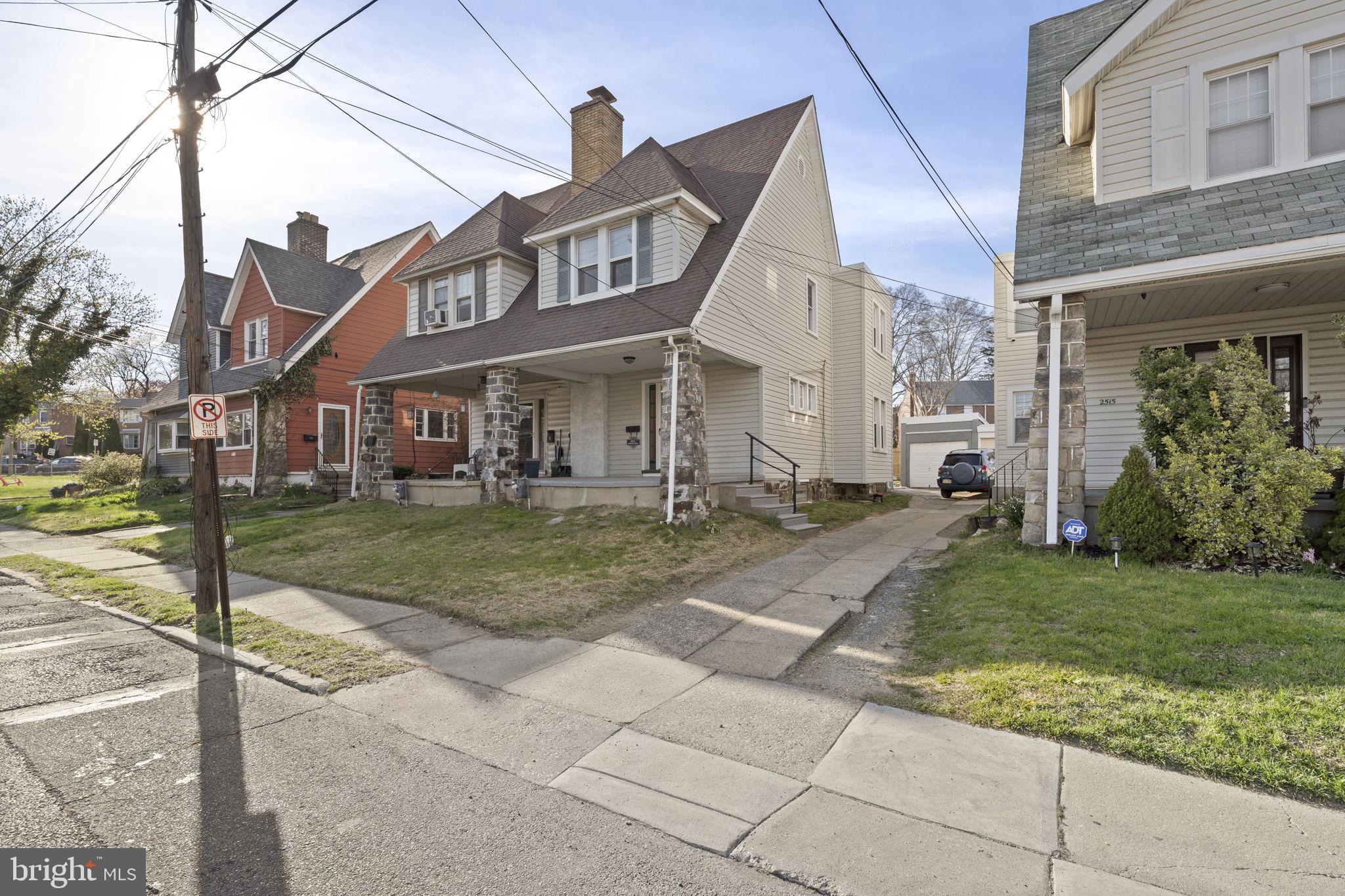 Welcome to 2517 Marshall Road — a beautifully renovated 3-bedroom, 1.5-bath twin in the heart of Drexel Hill, where classic charm meets completely modern living. From the covered front porch with original stone columns to the fully fenced rear yard and detached garage, every detail of this home has been thoughtfully updated for today's buyer. Step inside to a bright, open main level featuring a wood-burning fireplace with sleek black surround, recessed lighting, and new luxury vinyl plank flooring throughout. The open-concept layout flows seamlessly from the living room into the dining room — highlighted by a stunning full wall of exposed original brick — and into the brand new kitchen, complete with white shaker cabinetry, quartz countertops, subway tile backsplash, matte black fixtures, and stainless steel appliances. Upstairs you'll find three generously sized bedrooms with LVP flooring and ample closet space, plus a fully renovated full bath featuring graphic black-and-white tile, a white vanity with matte black hardware, and a backlit mirror. A convenient half bath completes the main level.  A french drain has been installed in the basement. The mechanicals have been updated including new electrical, and new plumbing,  giving buyers true peace of mind from day one. Outside, enjoy a  white vinyl fenced yard perfect for entertaining, plus a detached garage for storage or parking. Located minutes from schools, parks, shopping, and major commuter routes into Philadelphia, 2517 Marshall Road offers the space, updates, and location today's buyers are looking for. Nothing to do but move in. 3 Bedrooms | 1.5 Bathrooms | Detached Garage | Fenced Yard | New Electrical | New Plumbing | New Kitchen | Renovated Bathrooms | LVP Throughout | New French Drain | Drexel Hill, Delaware County