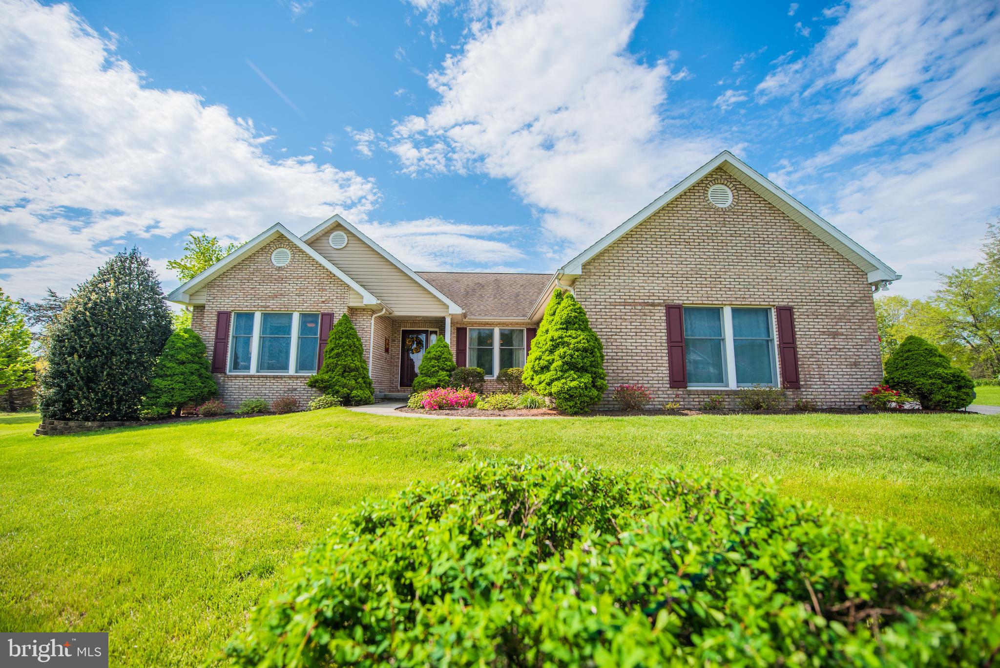 ON A SCALE 1 TO 10 THIS IS AN 11 - You'll fall in love this this spacious ranch home on 1.728 open acres close to the town on Berkeley Springs WV.  This home features an open floor plan with family room, kitchen, and breakfast room combo.  Sun room off the family room with new windows and custom shades. Large master bedroom with custom closet, master bath with ceramic tile-floor to ceiling, granite vanity top, custom cabinets and new French doors leading out to connector Trek patio. Patio furniture conveys.  New wood floors in the living rm, dining rm, and master bedroom. New ceramic tile in the kitchen with new granite counter tops and custom pantry.  New windows in the living room and master bedroom. Come and look at the landscaped back yard featuring a new stone walkway leading to a custom stone patio. More amenities are attached two car garage, ceiling fans, skylights, vaulted ceilings, mostly finished basement with workshop, office, bathroom and great room. Located in the peaceful desirable Ridge View Subdivision.