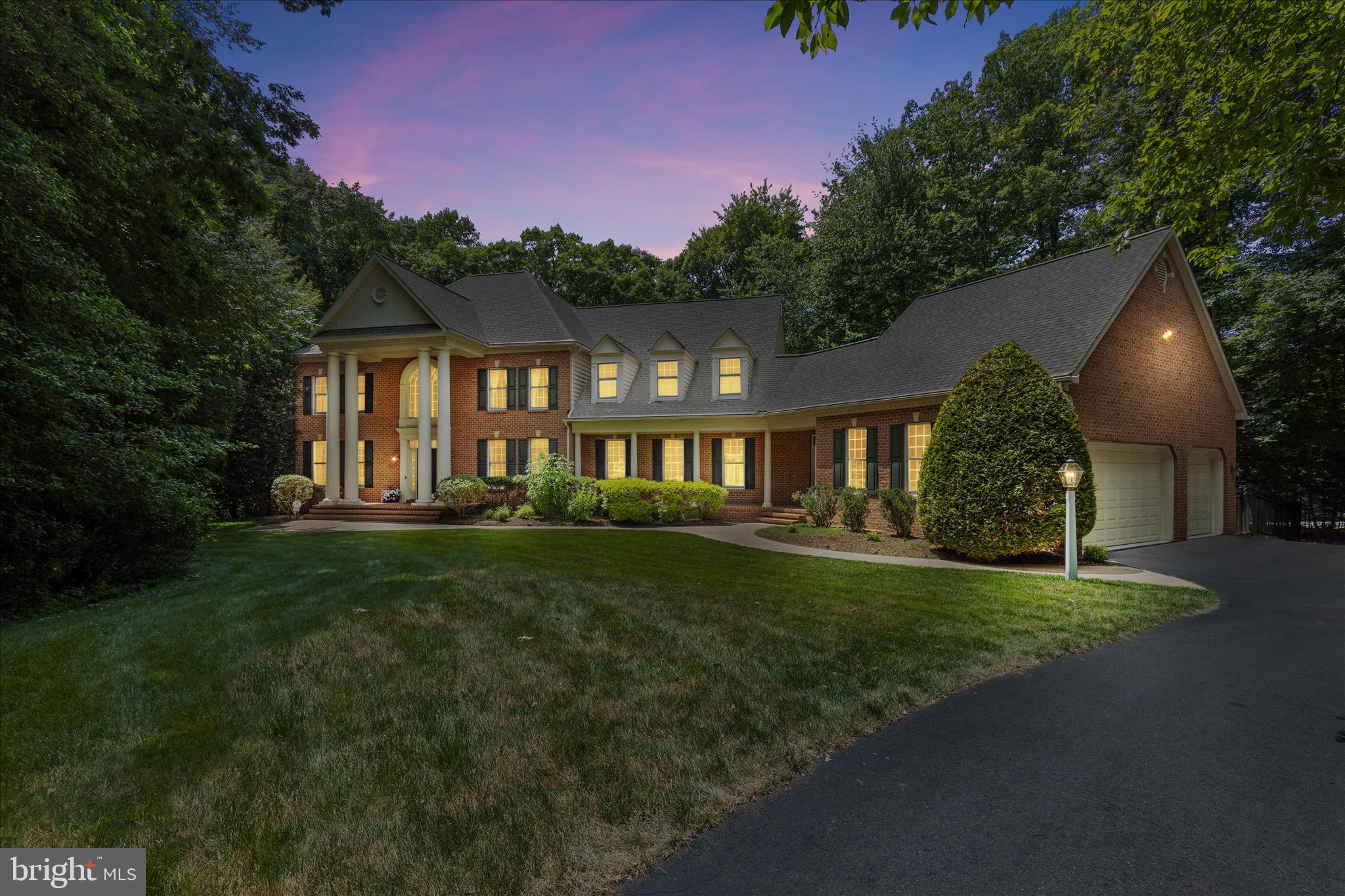 Built in 2001, this stately brick Koch Colonial offers 4,648 square feet above grade and is nestled on a private 5.73-acre cul-de-sac lot in the highly sought-after Broadneck School District, delivering the perfect blend of luxury, privacy, and timeless elegance. Featuring a stunning 2022 gourmet kitchen renovation, 5 bedrooms, 5.5 baths, a 3-car garage with new epoxy flooring, an extended driveway, and a 2,392-square-foot finished walk-up basement, this exceptional estate is designed for both comfortable living and grand-scale entertaining. A magnificent front portico with oversized columns, paver entry, and private side guest entrance welcomes you into a dramatic two-story foyer featuring a sweeping staircase, Palladian window, hardwood floors, and detailed custom moldings. The home's thoughtfully designed floor plan also features dual staircases, providing both elegance and everyday convenience. The remodeled gourmet kitchen is the heart of the home, showcasing stacked custom white and light seafoam-green cabinetry, quartz countertops, designer backsplash, under-cabinet lighting, a large center island with storage, premium appliances, and a butler's pantry. The inviting family room boasts 10-foot ceilings, a wood-burning fireplace, and a wet bar, while the formal dining room is accented by crown molding, picture-frame trim, and elegant fixtures from Annapolis Lighting. The main level also features 9-foot ceilings, a private office, laundry room, updated full bath, and a versatile fifth bedroom or guest suite. Upstairs, the massive primary suite offers a sitting area, spa-inspired bath, and oversized walk-in closet. Three additional generously sized bedrooms each feature private en-suite baths and walk-in closets. Two of the secondary bedrooms have been enhanced with custom-themed murals painted by a local artist, adding character and charm. The expansive walk-out lower level adds 2,392 square feet of finished living space with abundant storage and a bath rough-in, providing endless opportunities for recreation, fitness, a home theater, guest quarters, or multi-generational living. Outside, enjoy your own private resort featuring a heated saltwater PebbleTec pool with three waterfalls and a diving rock, surrounded by multiple paver and flagstone patios, extensive hardscaping, professional landscaping, outdoor lighting, irrigation, and a combination of aluminum and wood fencing. The property is also outdoor speaker ready, making it ideal for entertaining poolside or hosting gatherings throughout the grounds. Additional amenities include Andersen windows, low HOA fees, a Generac generator, radon mitigation system, alarm system, a whole-home sound system with indoor and outdoor audio capability, and invisible fence readiness. Recent improvements include a 30-year architectural roof (2022), complete gourmet kitchen renovation (2022), main-level full bath renovation (2022), new upper-level and lower-level quality carpeting (2026), and epoxy garage flooring (2026). Offering more than 7,000 square feet of finished living space, resort-style amenities, exceptional craftsmanship, and a premier location within the highly sought-after Broadneck School District, this extraordinary Annapolis estate presents a rare opportunity to enjoy luxury living at its finest. Enjoy convenient access to the new Anne Arundel County Walking Trail, perfect for outdoor recreation and exercise. This home is located adjacent to Windsor Farm Elementary School and just minutes from Rt. 50, providing easy access to Downtown Annapolis, Washington, D.C., Baltimore, and Maryland's Eastern Shore beaches. Contact me today to schedule your private tour.