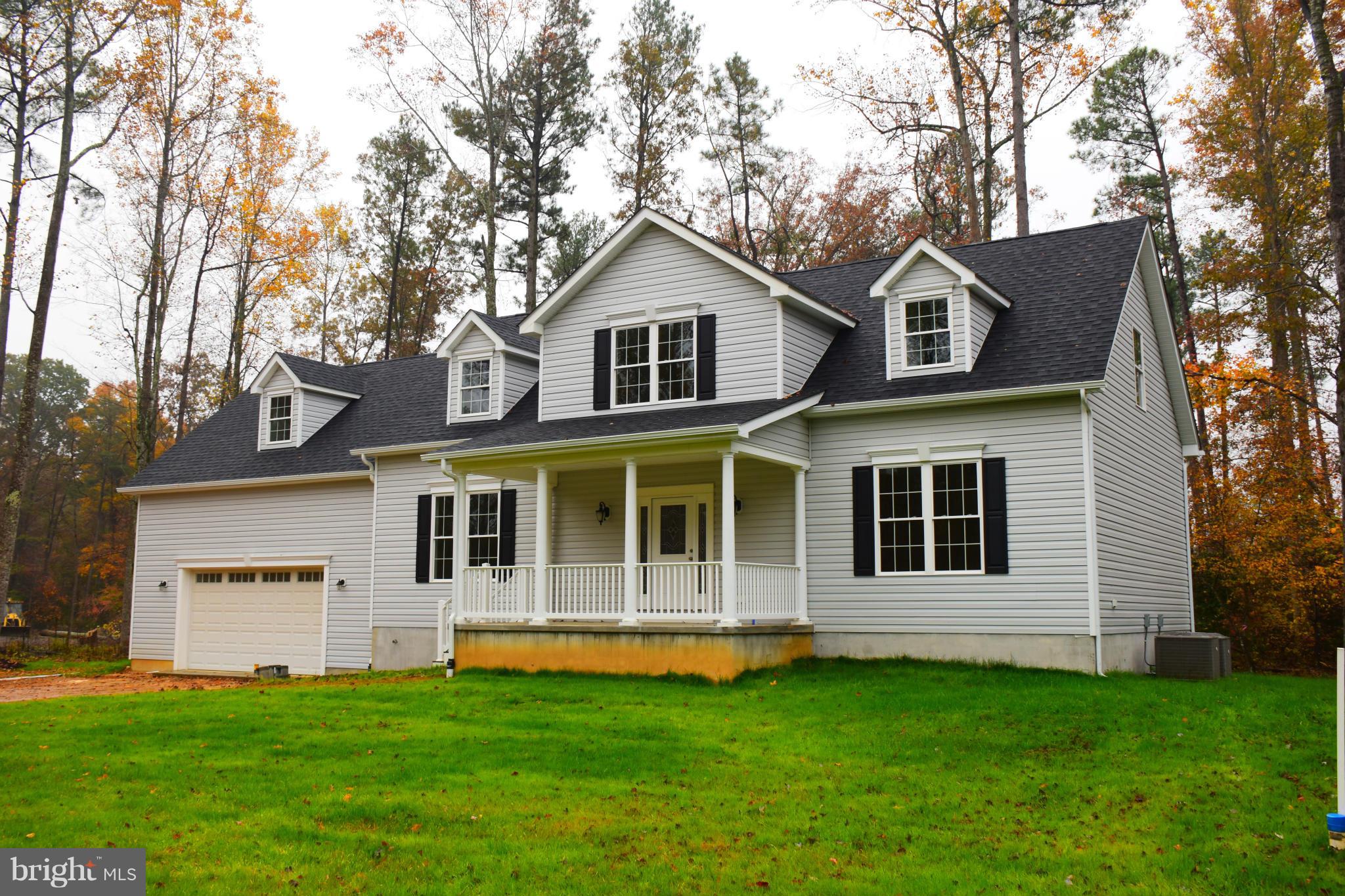 Brand new cape cod with master suite on main level. Kitchen has upgraded cabinets, granite & stainless appliances. Hardwood floors.  Patio doors to back deck. Huge unfinished bonus room over garage.  Unfinished basement. Over sized garage 25 x 27.  Ceramic tile in kitchen and baths.  Separate vanities in master bath w/ Jacuzzi tub & separate shower.