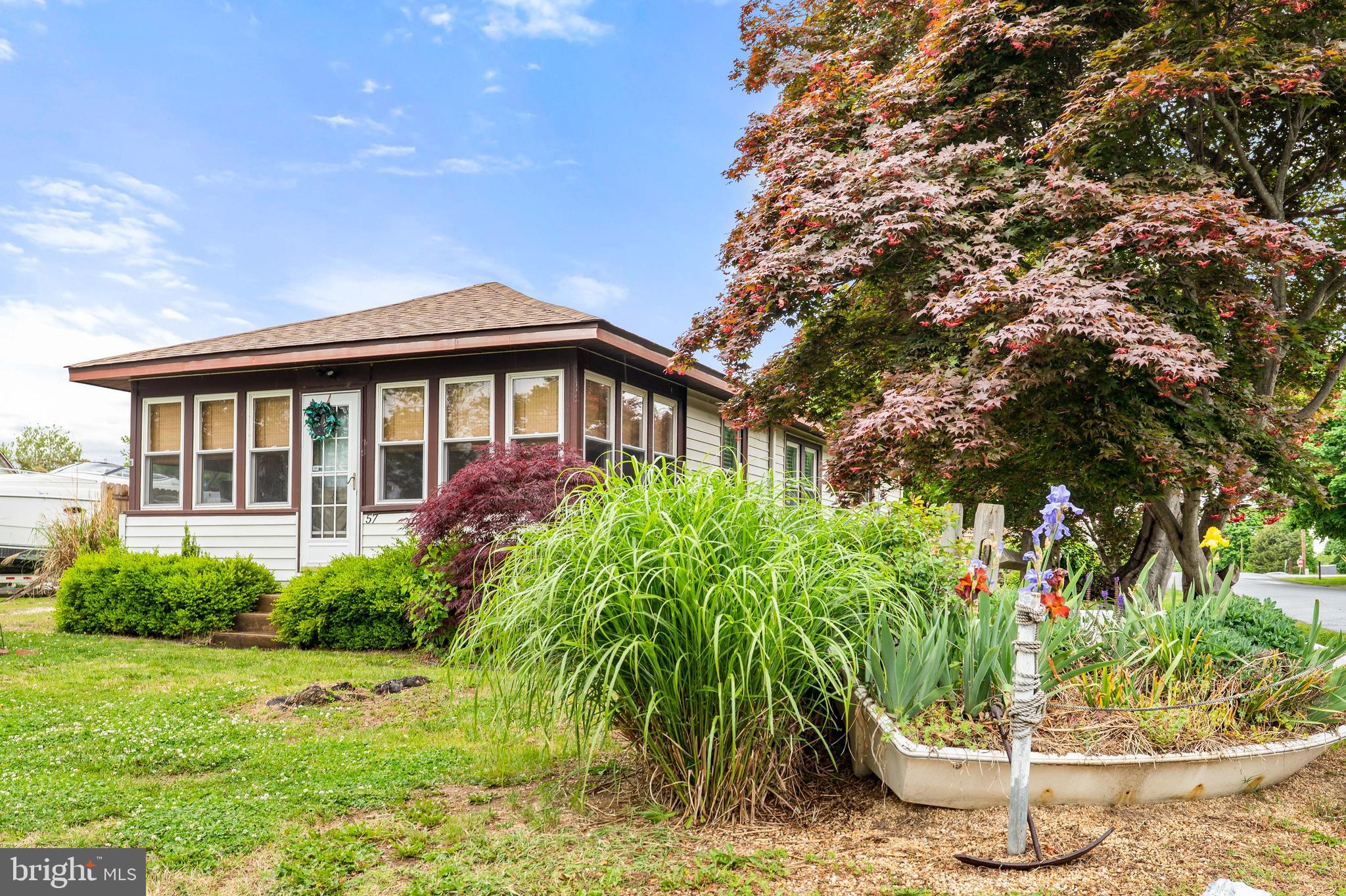 Affordable & adorable summer cottage.  Ready to move right in and start enjoying life on the Chesapeake Bay.  There is a gas furnace and central air conditioning so you can stretch the seasons for maximum enjoyment.  A rear patio offers the perfect spot for your morning coffee or just catching up with the neighbors.  You also have a carport on the side of the cottage and access to the rear yard via alley and double gate in the fence.  Terrific sandy beach access is included and you also have the option of joining the yacht club to gain access to a more private beach area and potential slip rental.  Your premiere gateway to the Eastern Shore!